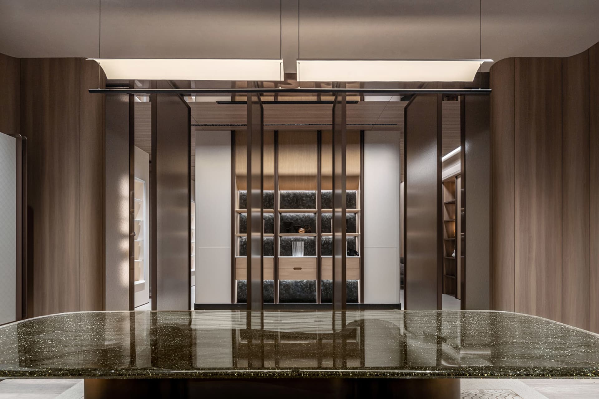 Modern storage closet with light wood finish and dark accents