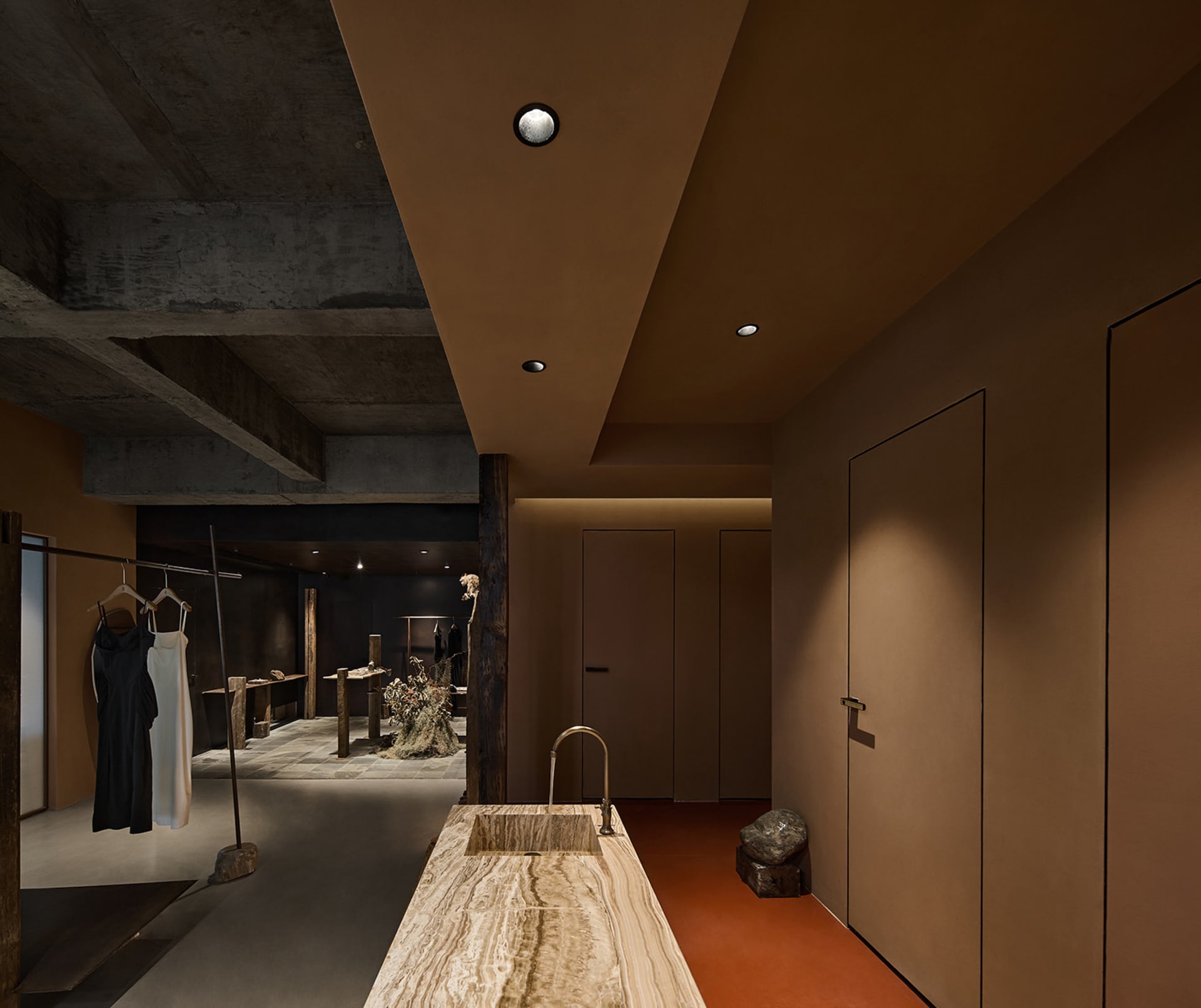 Modern retail storefront featuring concrete and marble materials.