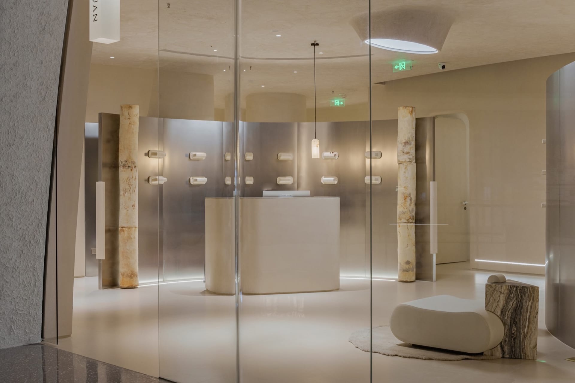 A sleek, modern retail storefront with concrete and marble features.