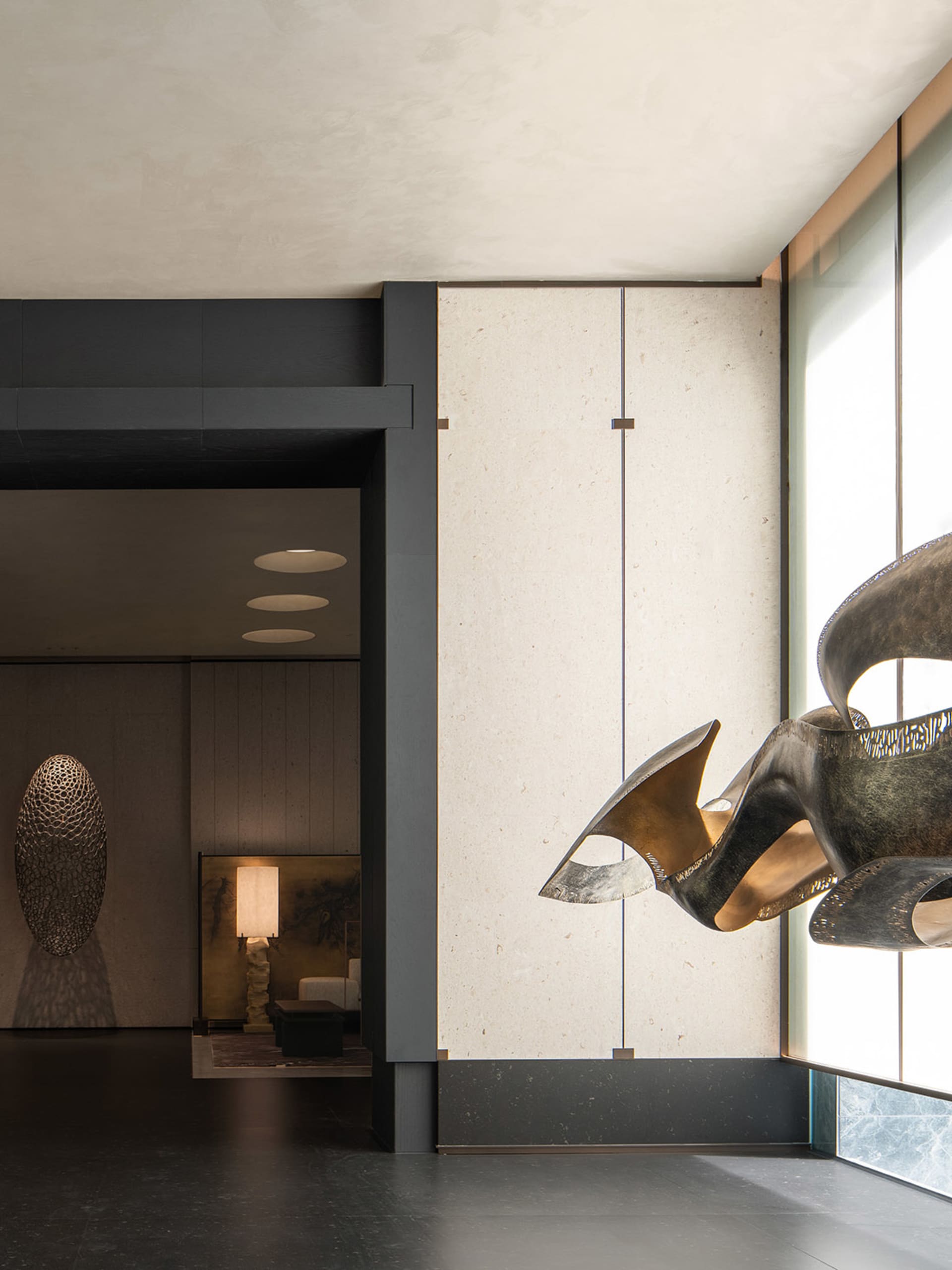 A modern interior design featuring artistic metal art on a wall