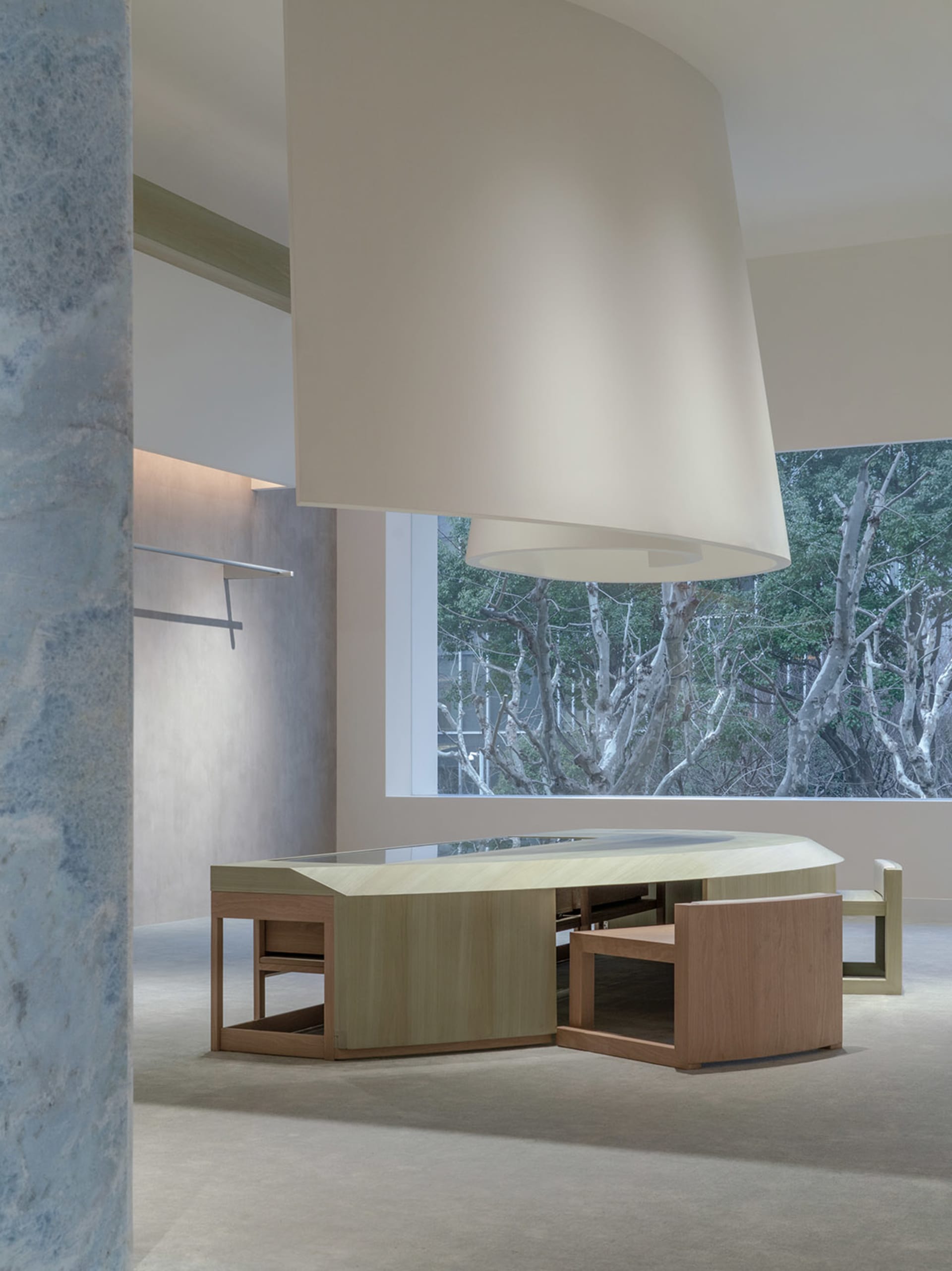 Modern interior with wooden furniture and glass walls