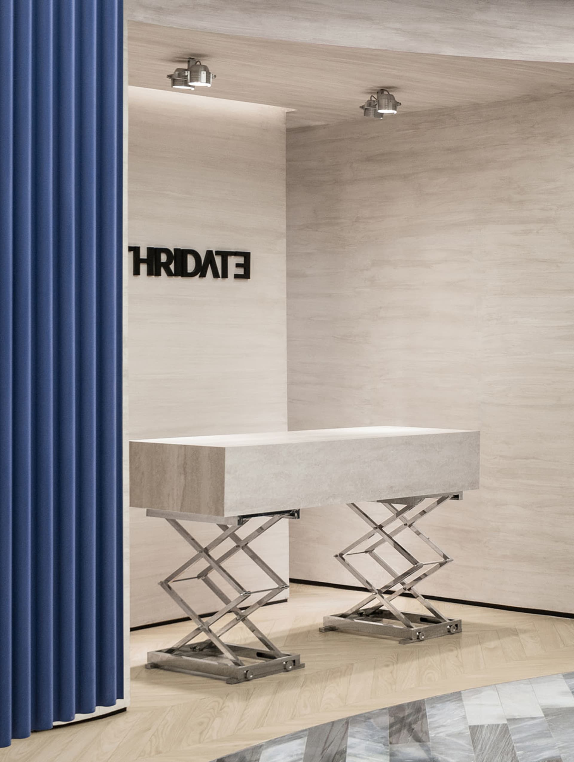 A modern office entry featuring a minimalist concrete desk with metallic legs and a blue curtain