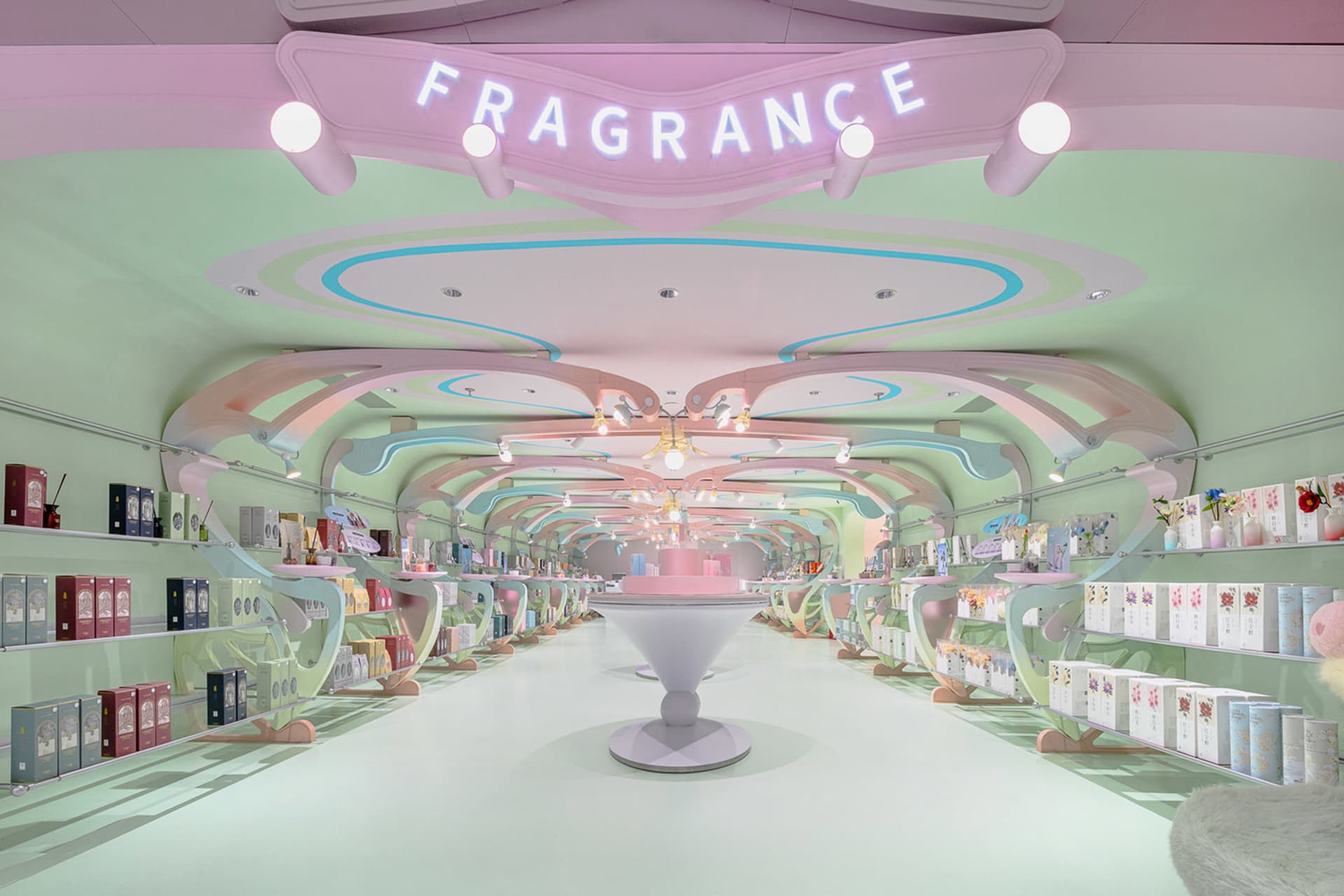 Modern retail store with a pastel color palette featuring fragrances
