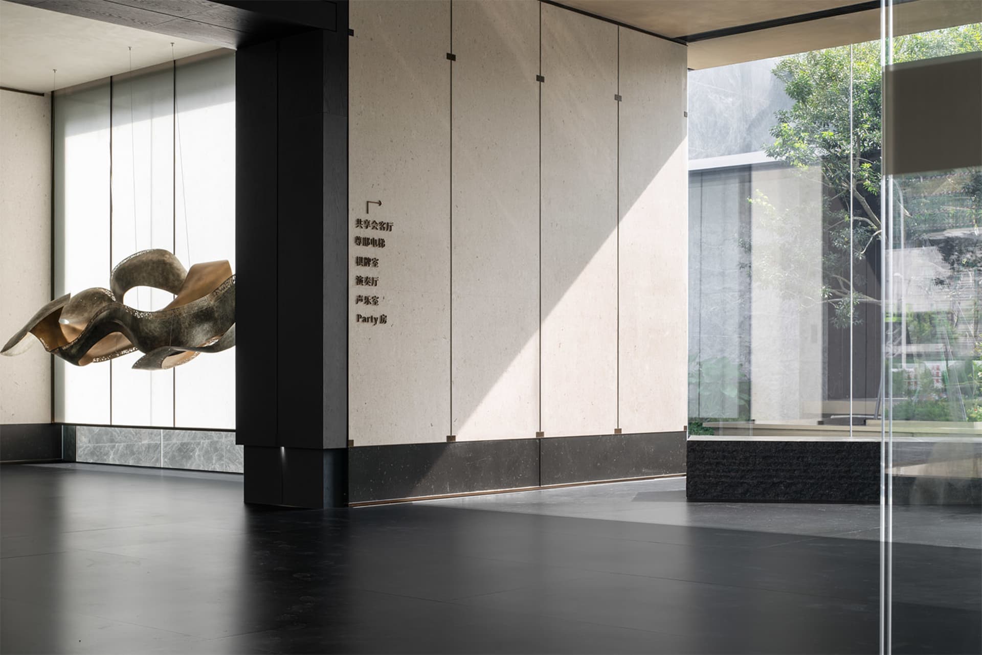 Modern lobby features contemporary art installation on concrete floor and walls