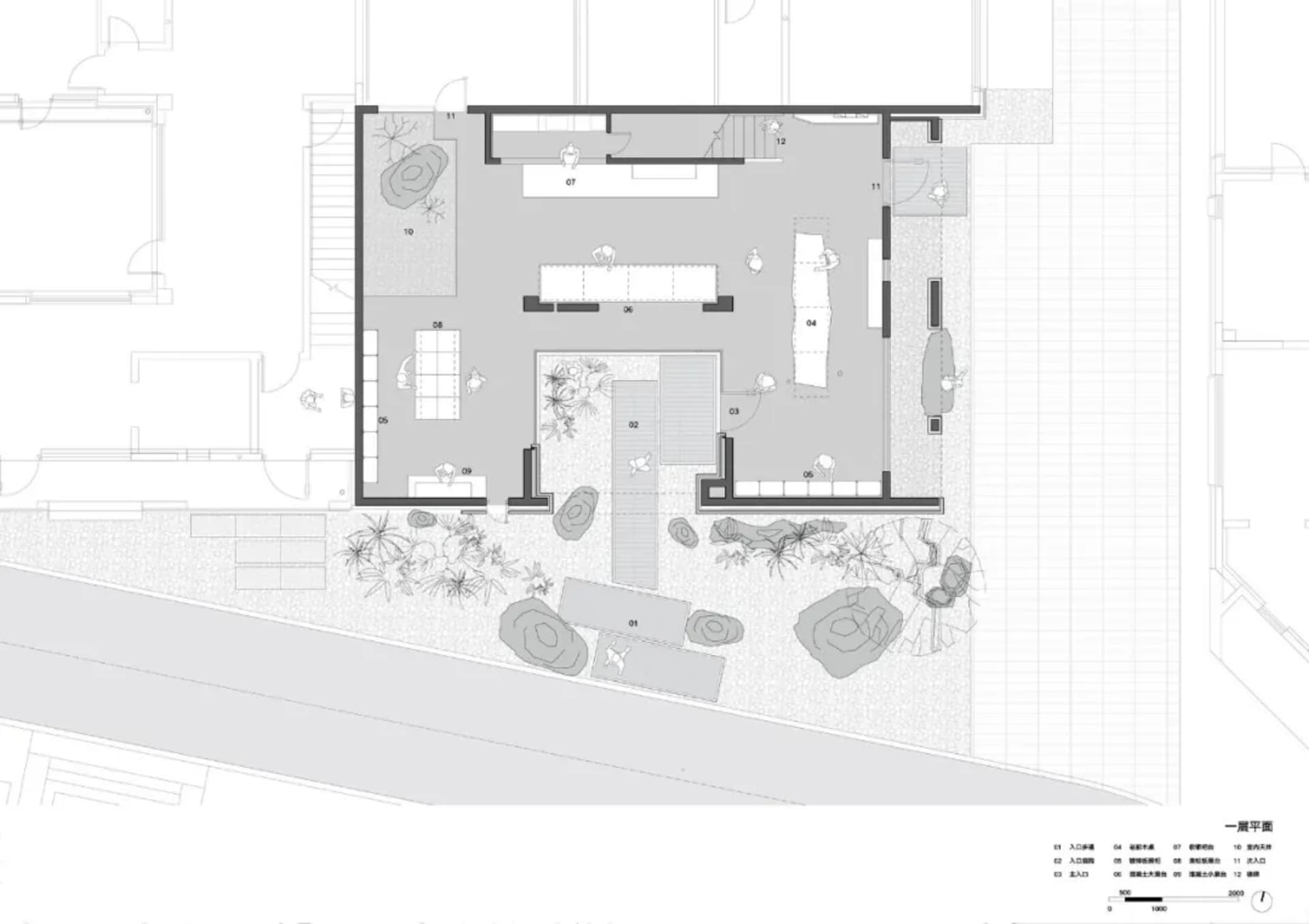 A detailed architectural floor plan featuring a modern industrial office space with concrete floors, brick walls, and large g
