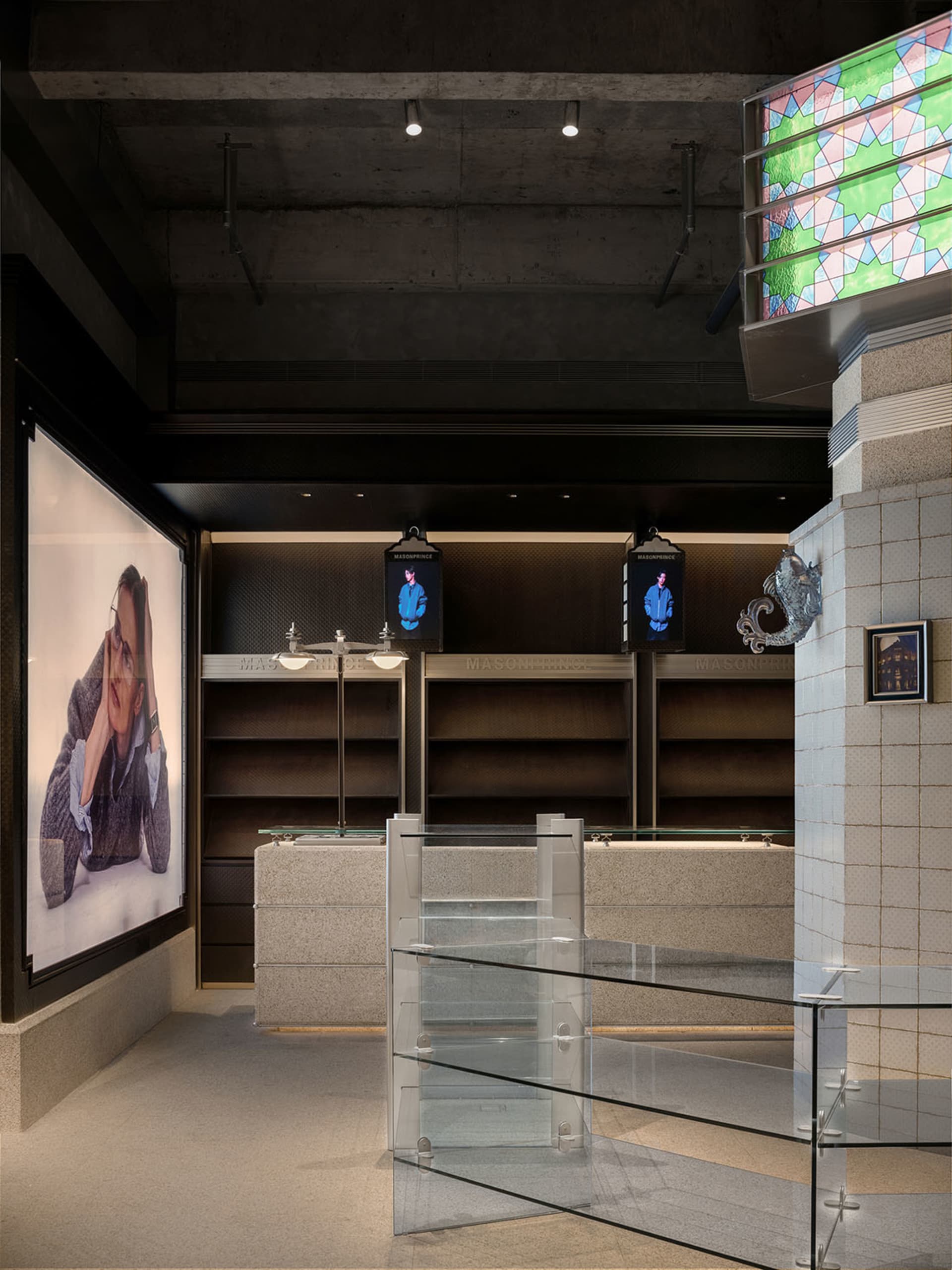 Modern retail store interior with concrete and glass elements.