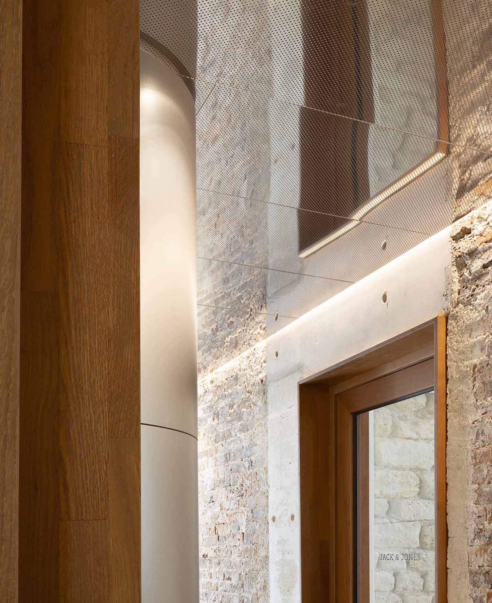 A modern storefront with concrete walls and a sleek, minimalist design.