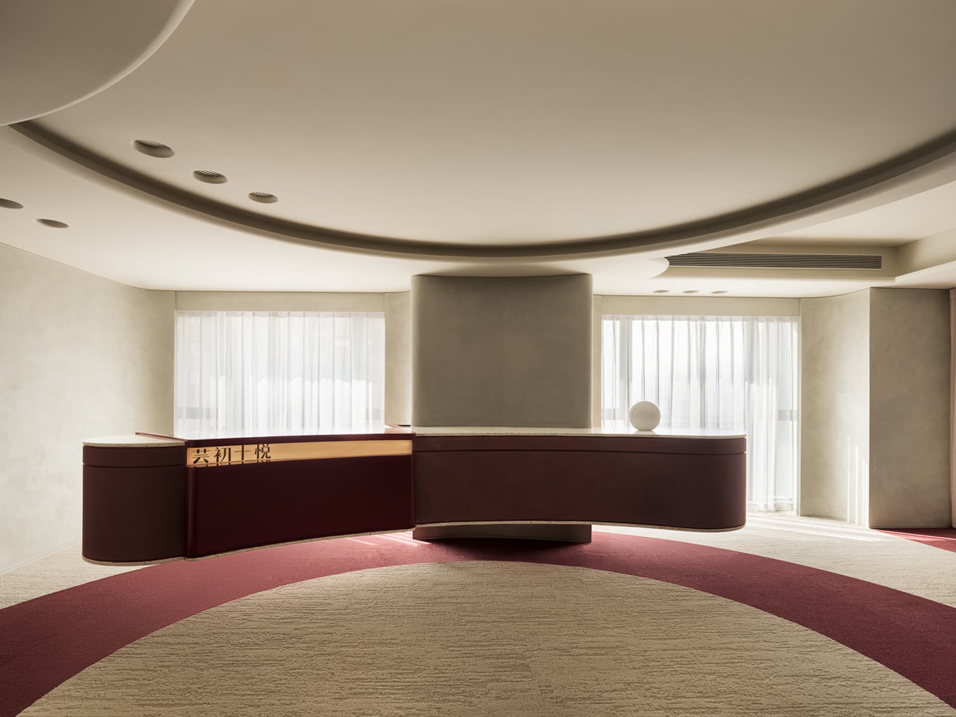 Modern minimalist lobby featuring sleek concrete design elements.