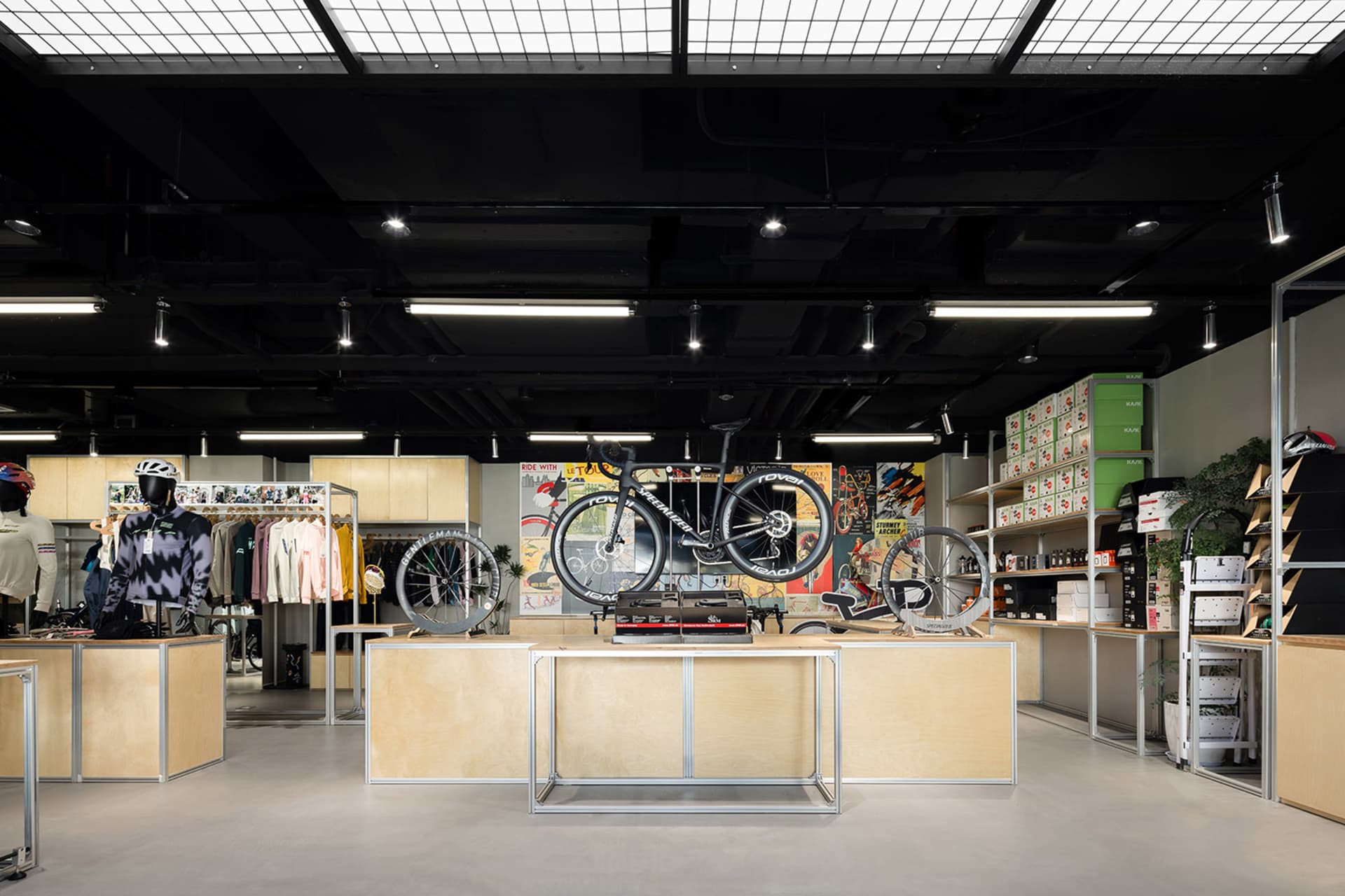 A cycling shop with wooden shelves, metal displays, and glass windows.
