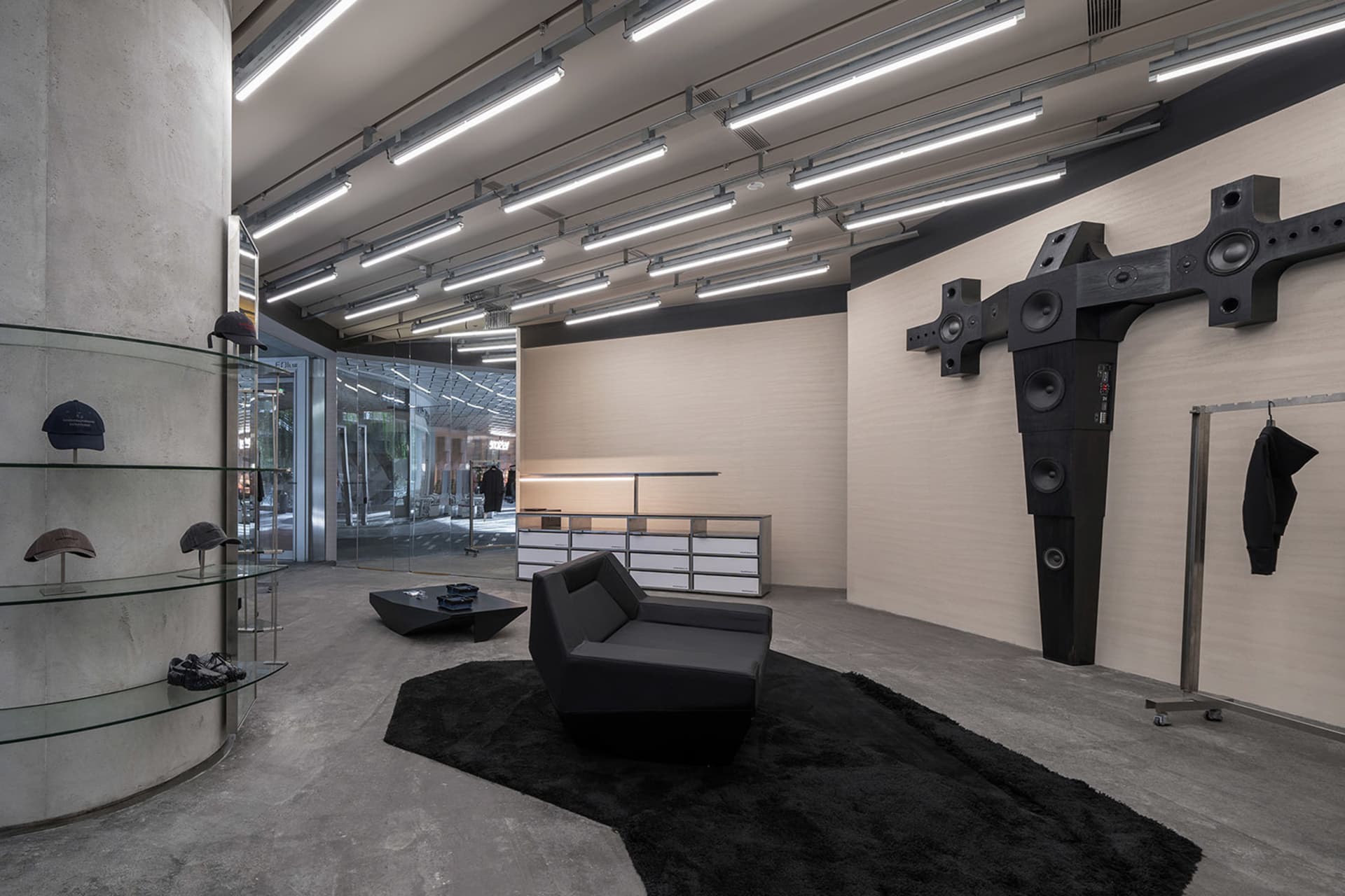 Modern retail storefront with concrete, glass, and metal materials