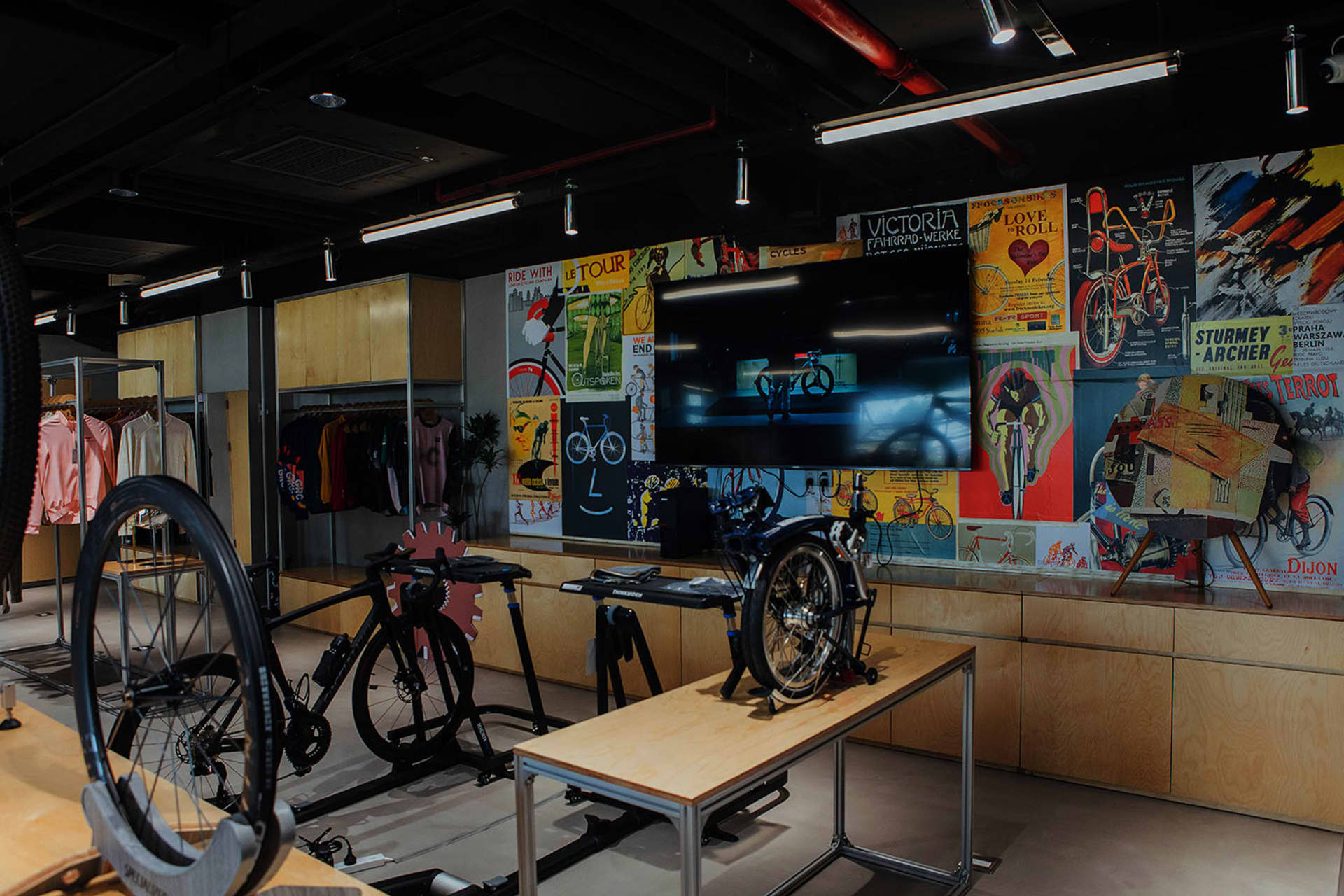 Retail store interior design featuring wooden elements and bicycles