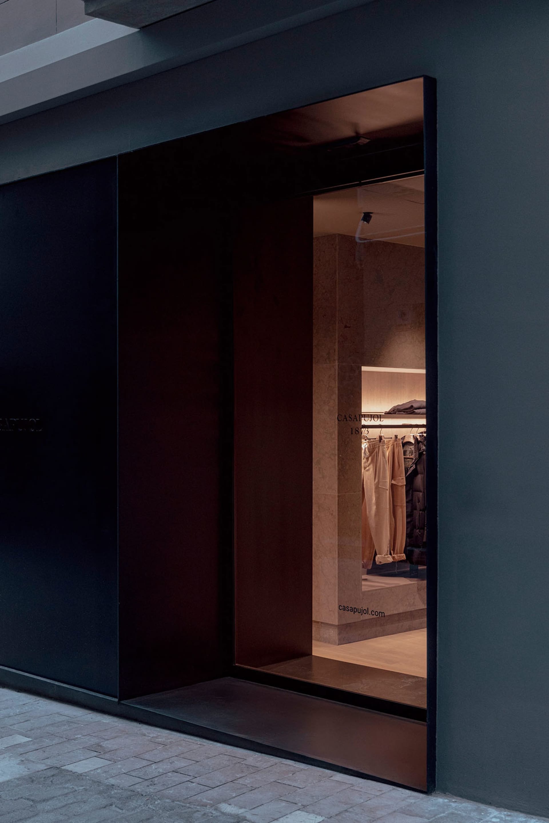 Modern retail storefront with glass and concrete materials