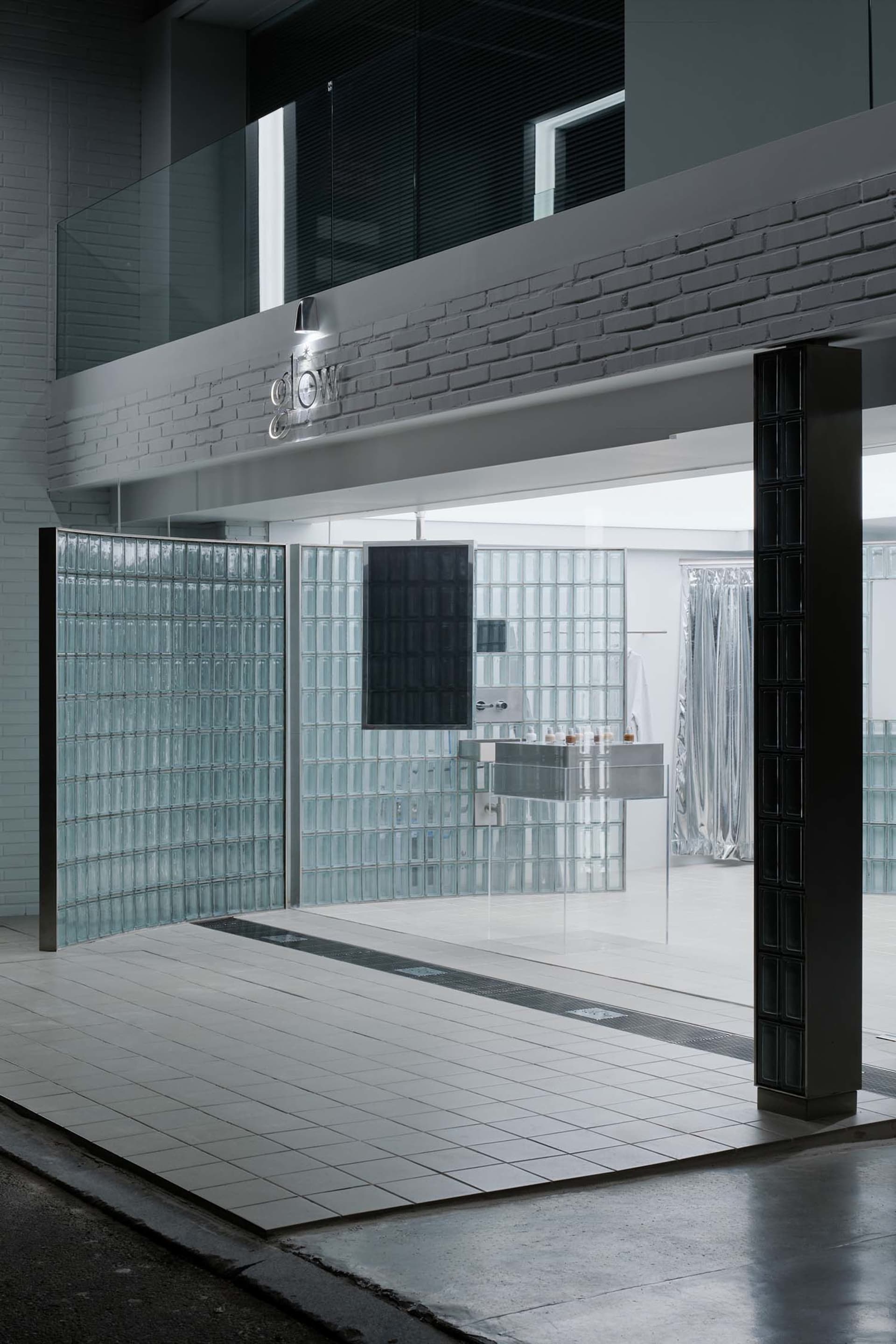 Modern spa interior with glass walls and minimalist design elements.