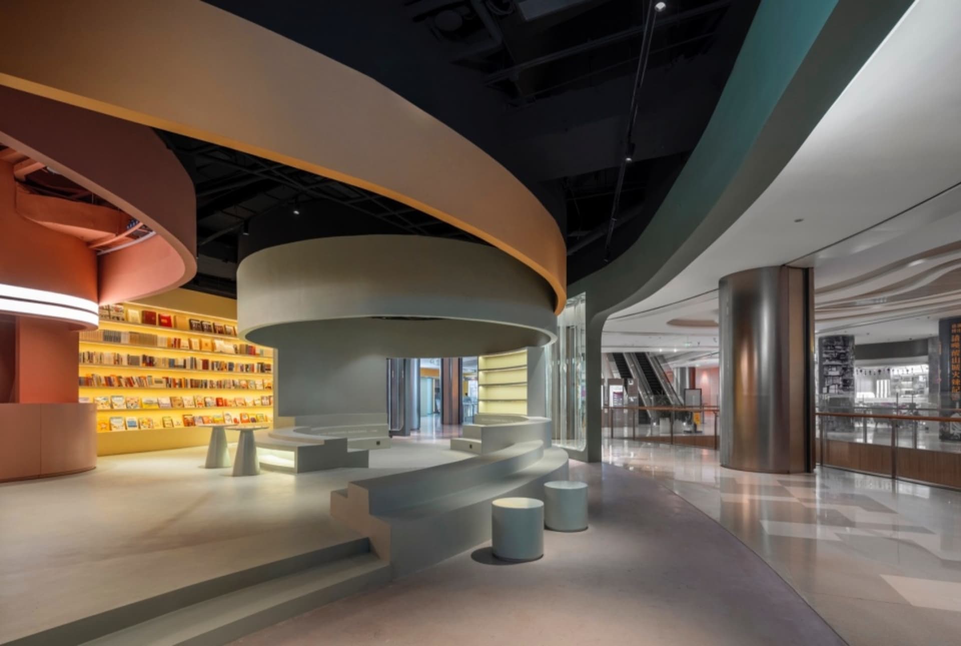 A modern office interior with concrete walls and glass partitions.