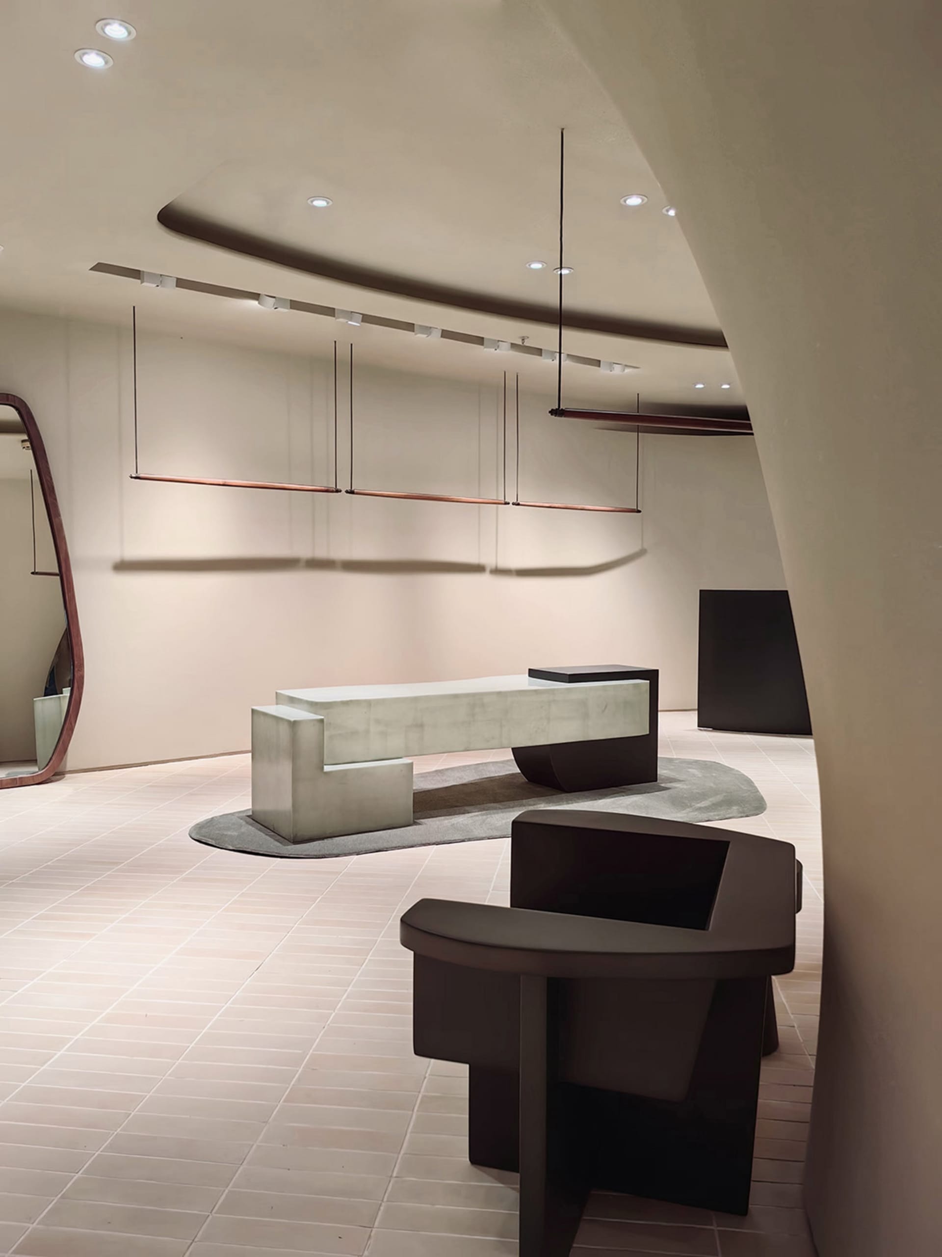 Modern commercial interior featuring minimalist design with concrete materials.