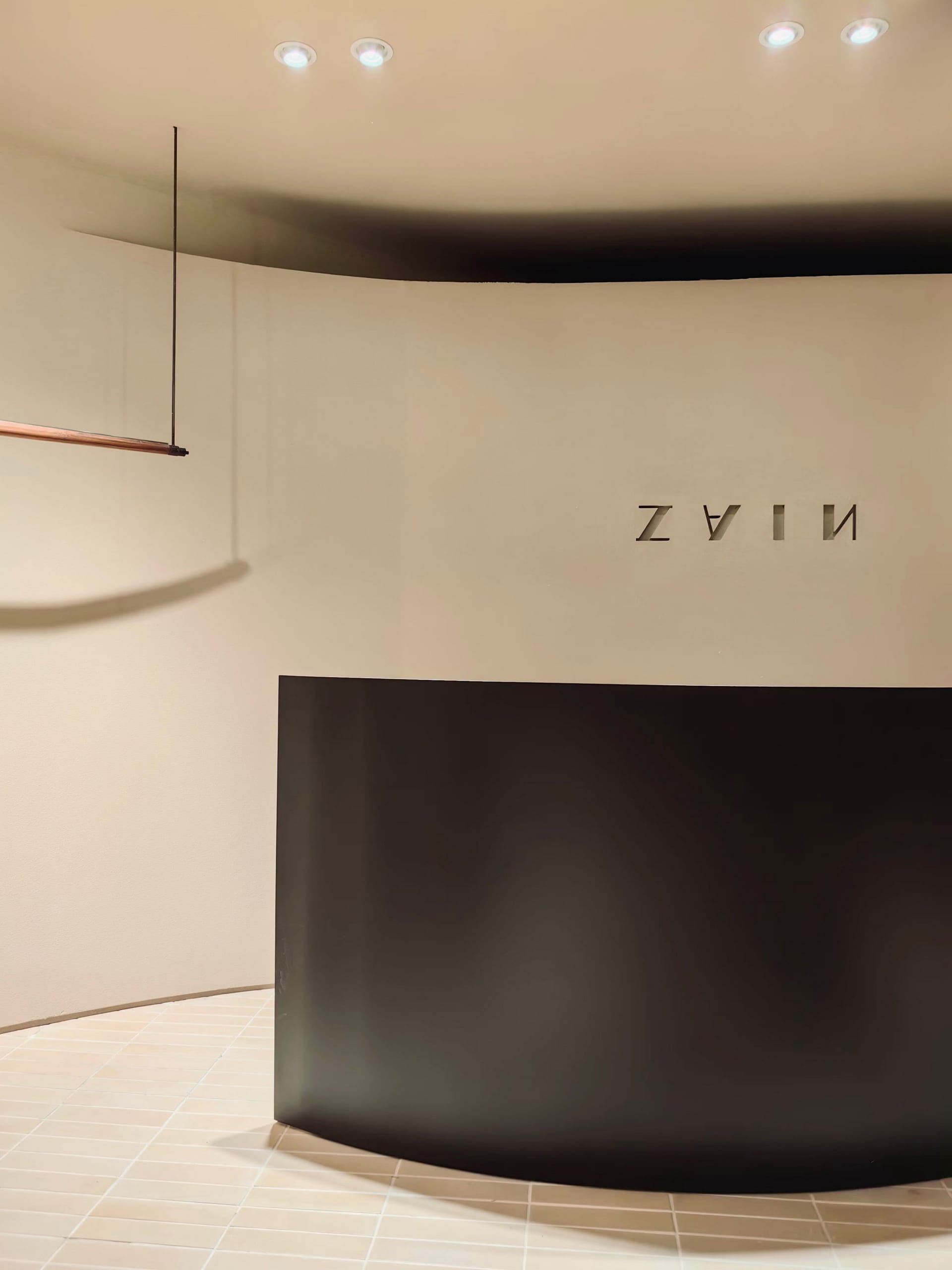 A modern reception desk with a metal frame.