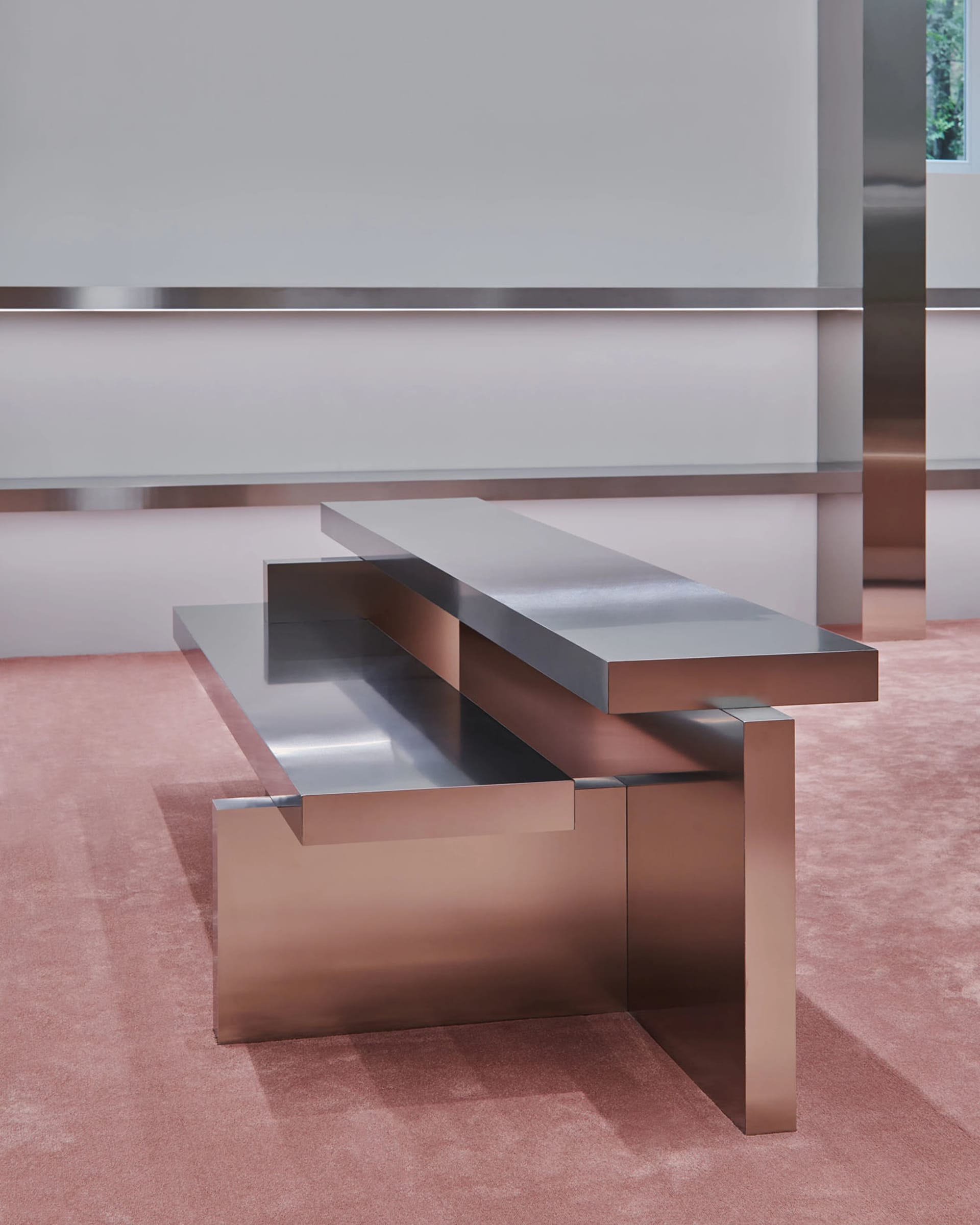 Modern metal bench with two shelves in minimalist interior design setting