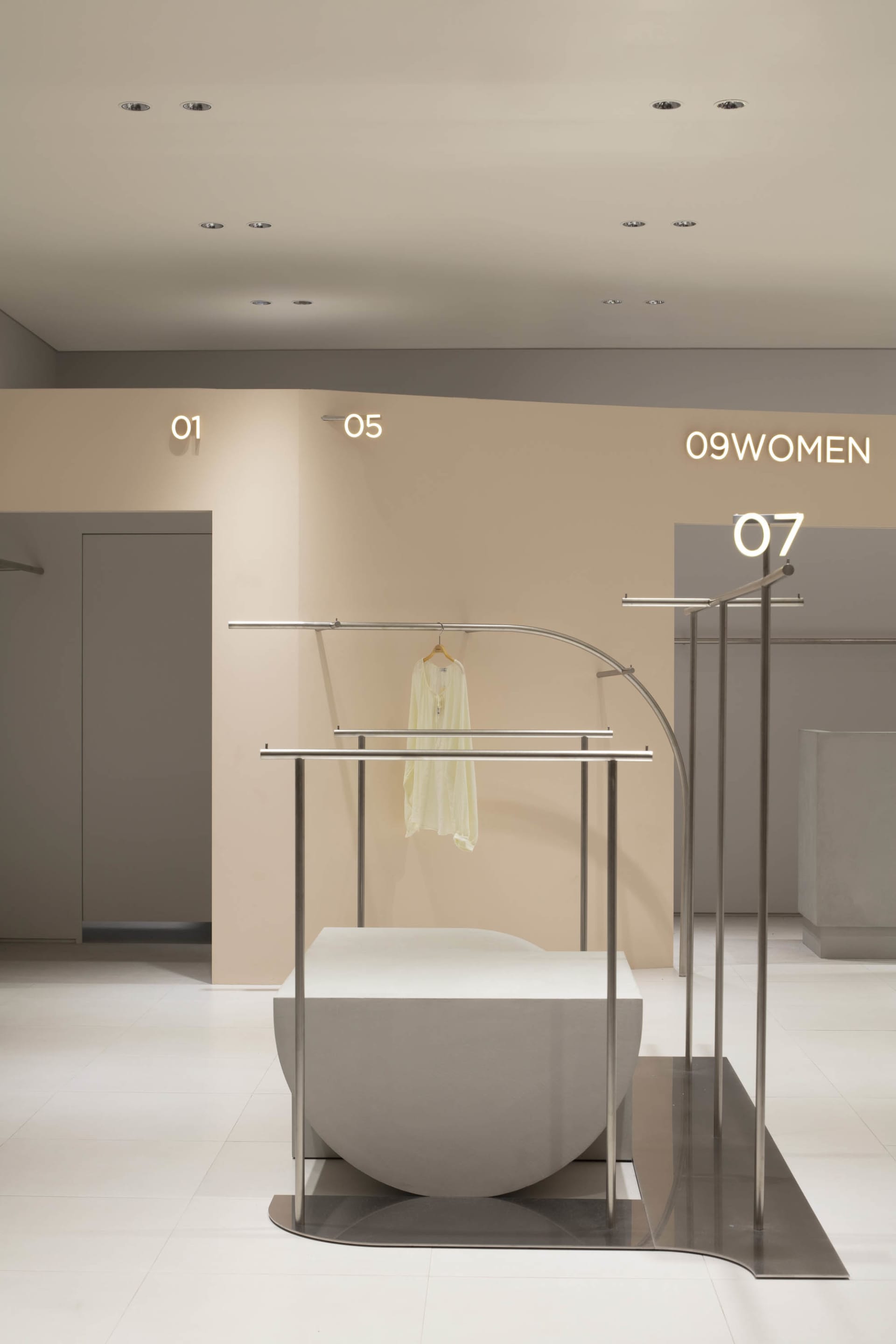 Modern retail store display featuring metal racks and signage.