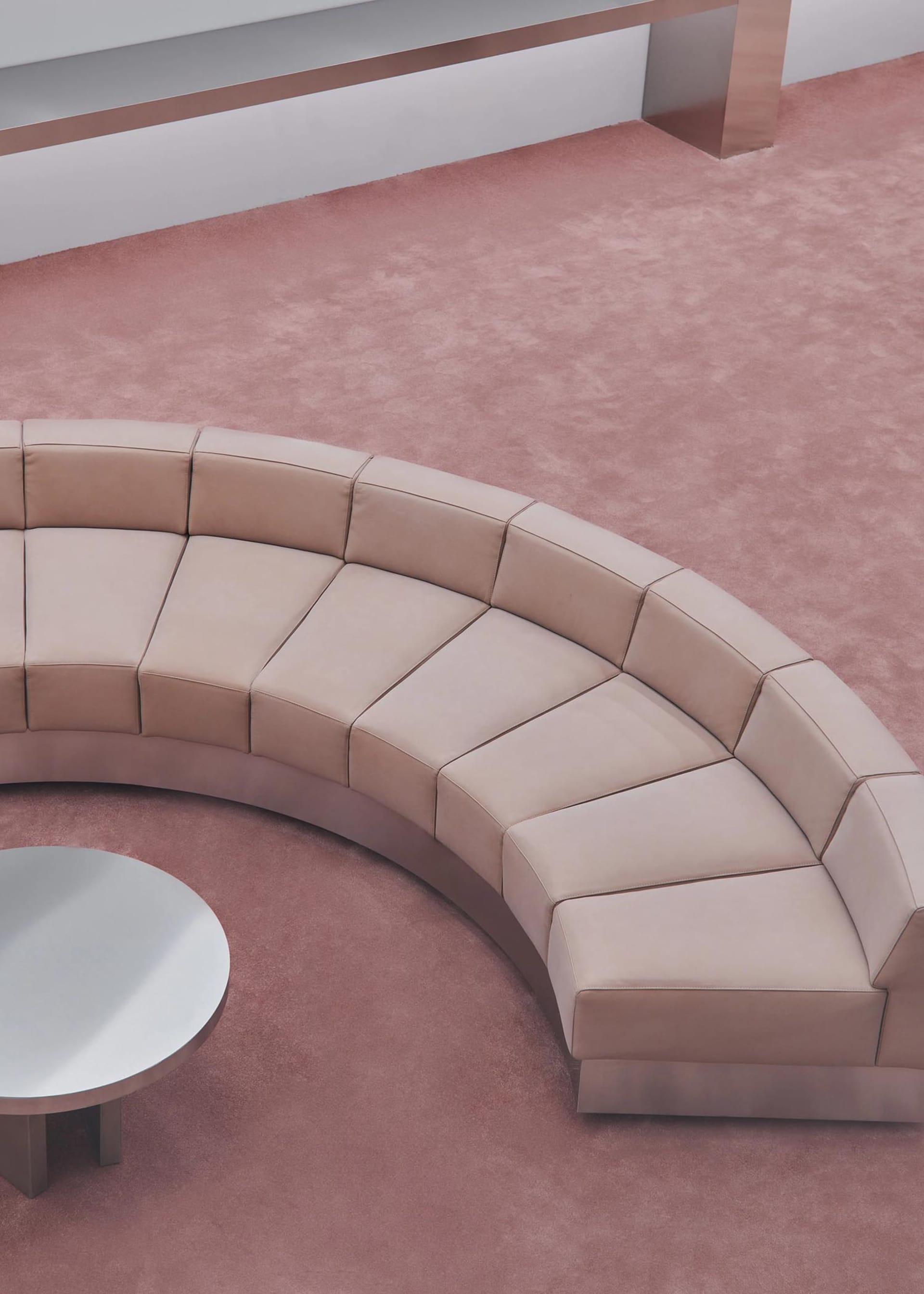 Modern circle-shaped leather sofa set with geometric design.