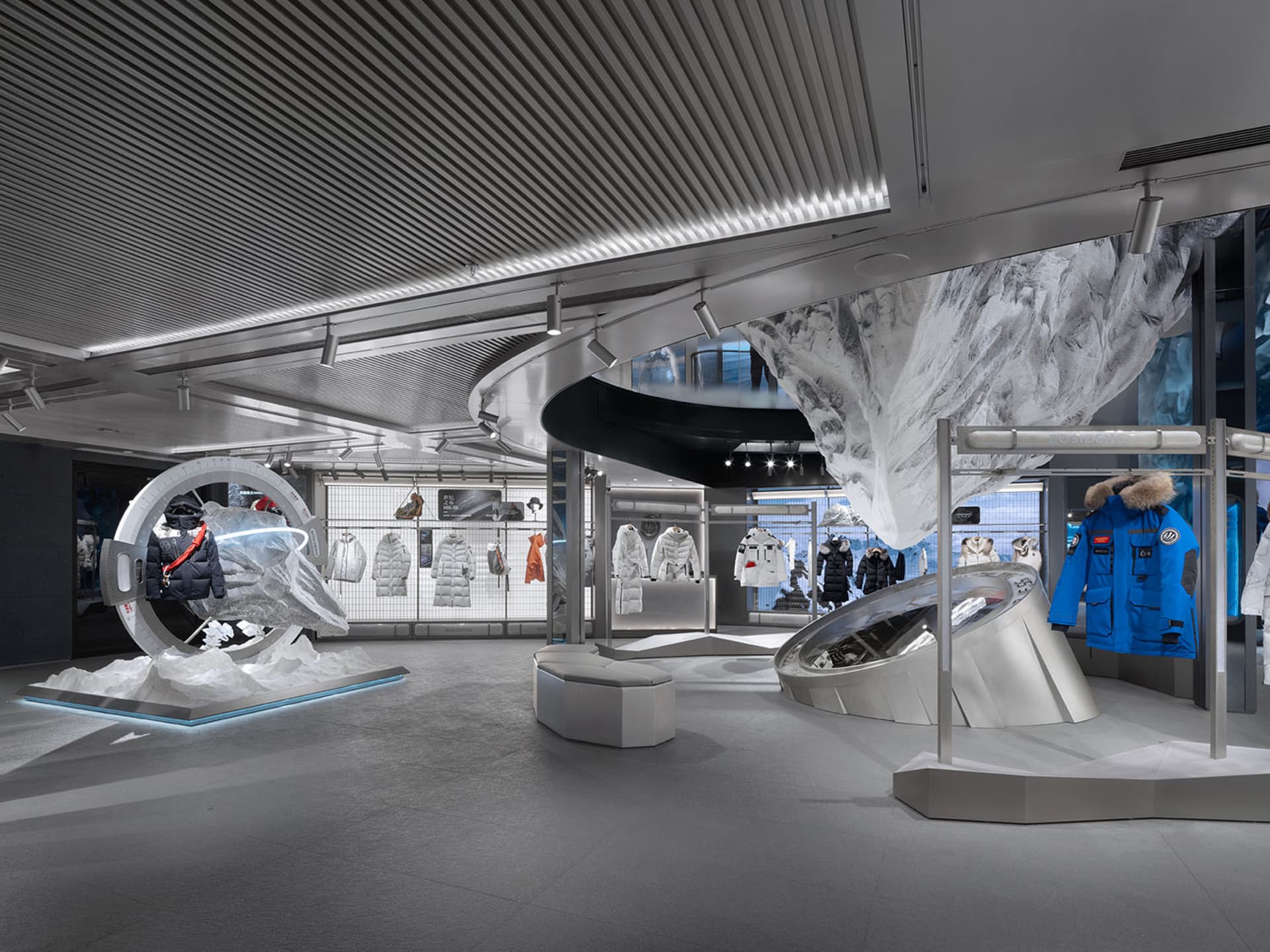 Modern retail storefront featuring metal, concrete, glass, and ice materials