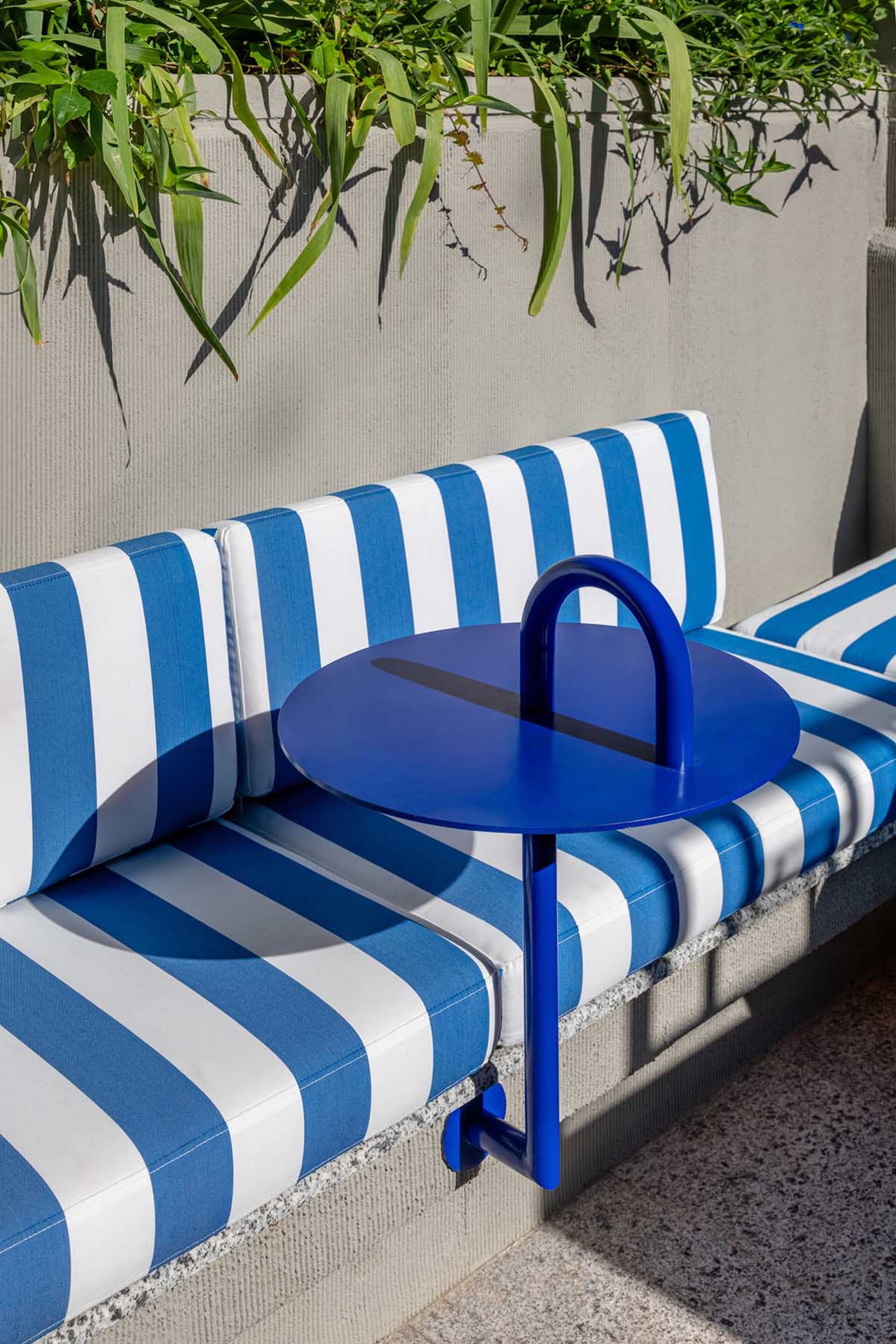 Blue and white striped cushions in a retail setting