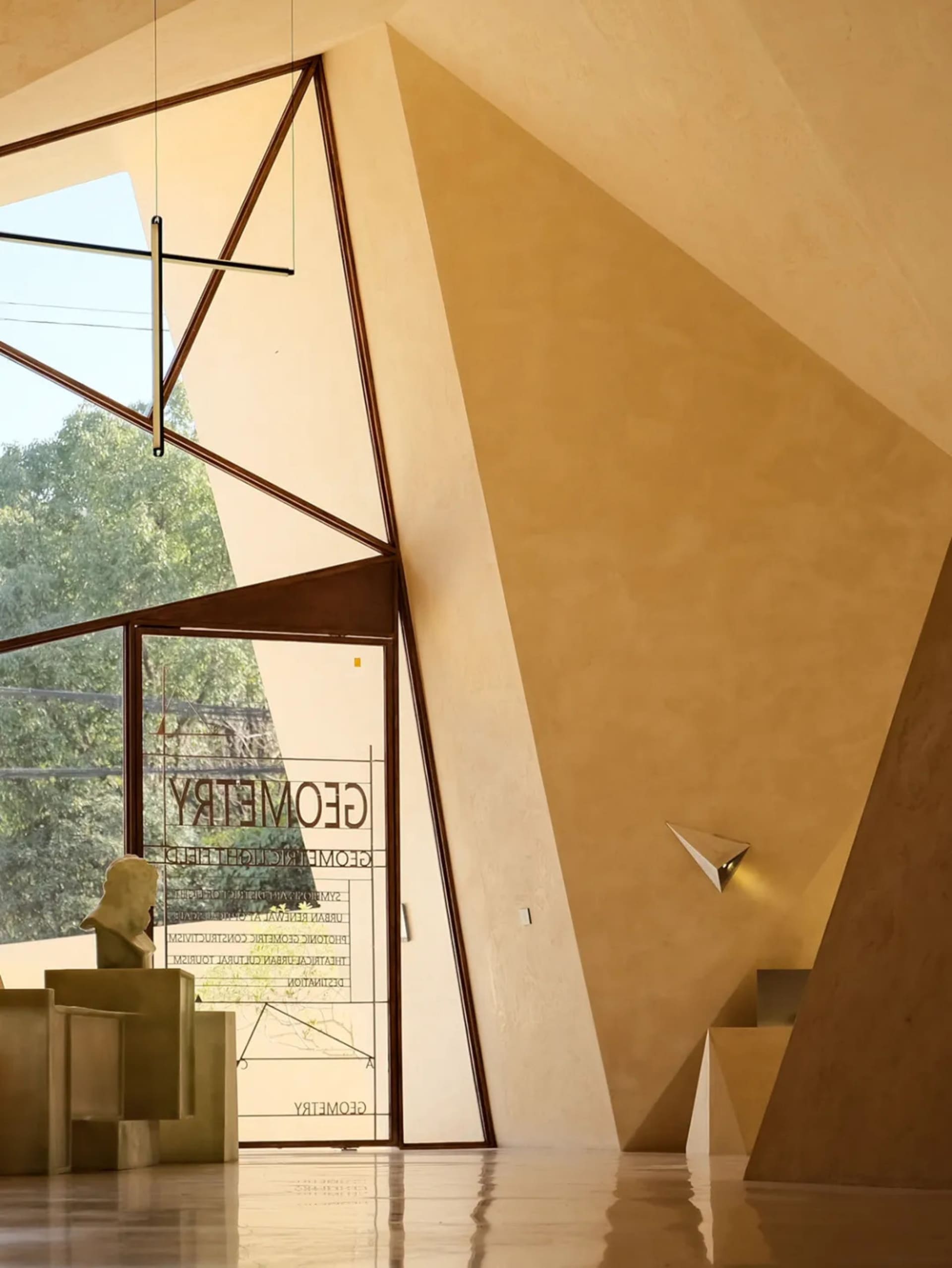 Modern entrance with metal, glass, and concrete materials