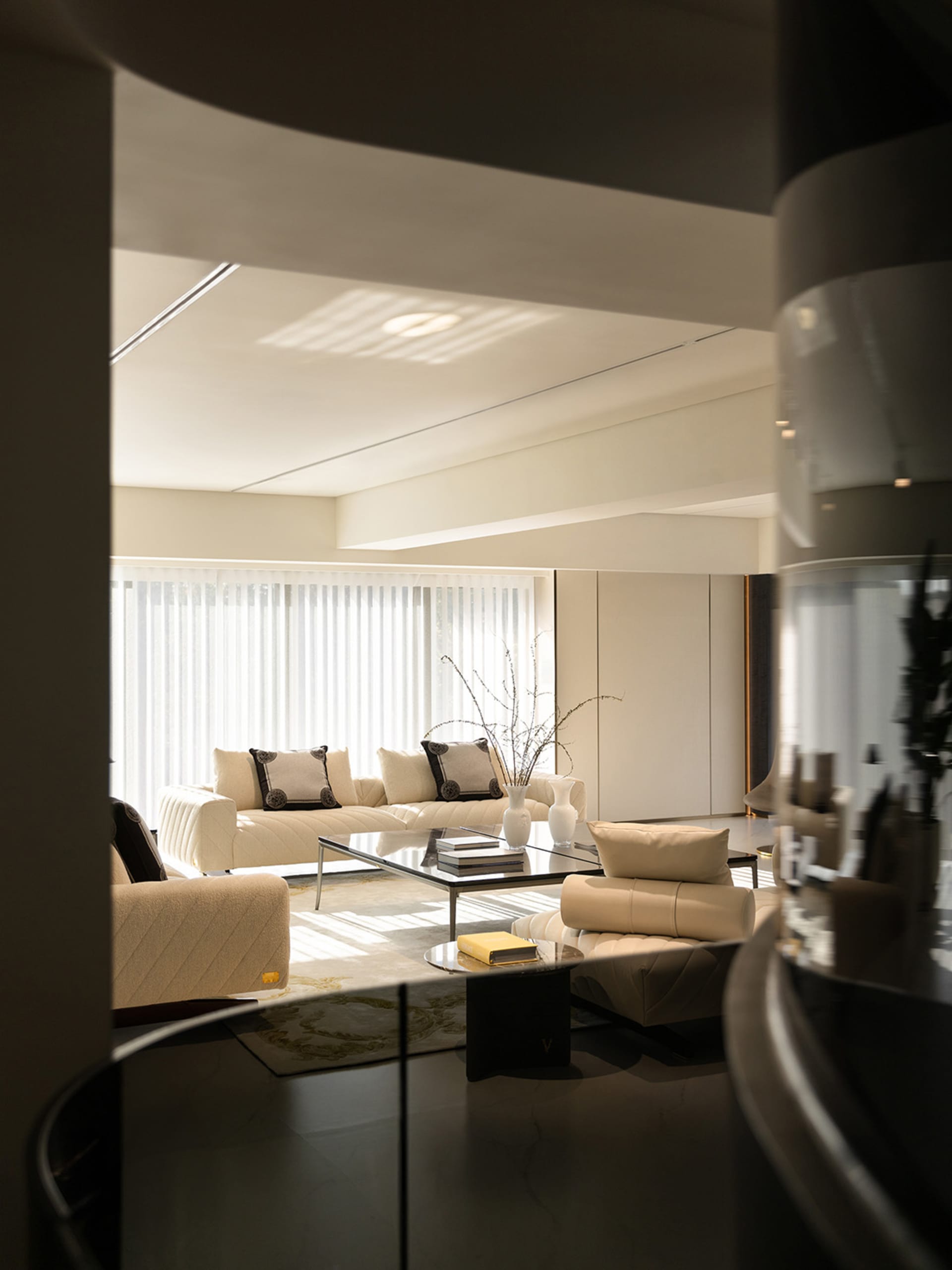 Modern white leather living room with minimalist design elements.