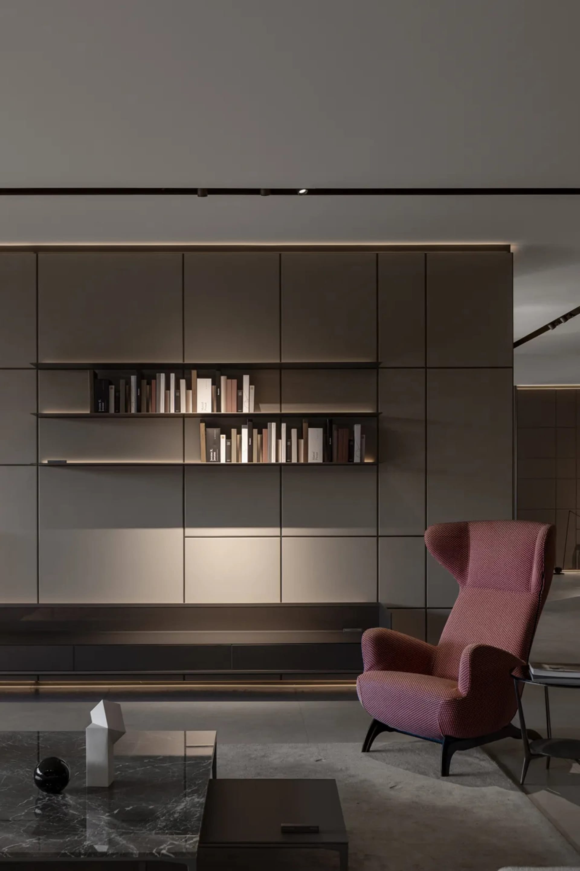 A modern living room featuring minimalist design with wood, glass, metal, and marble.