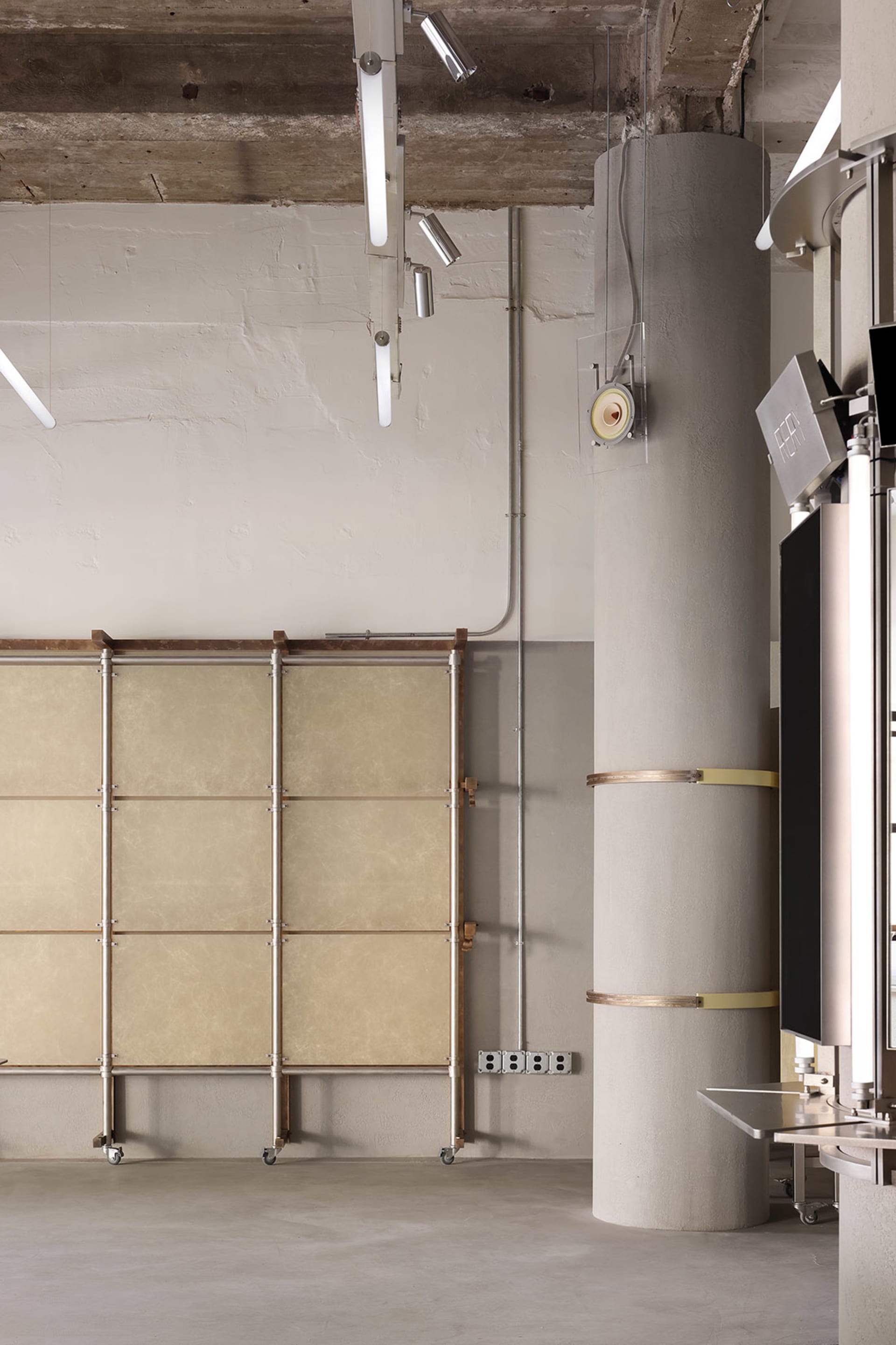 Industrial-style office space featuring concrete and metal materials.