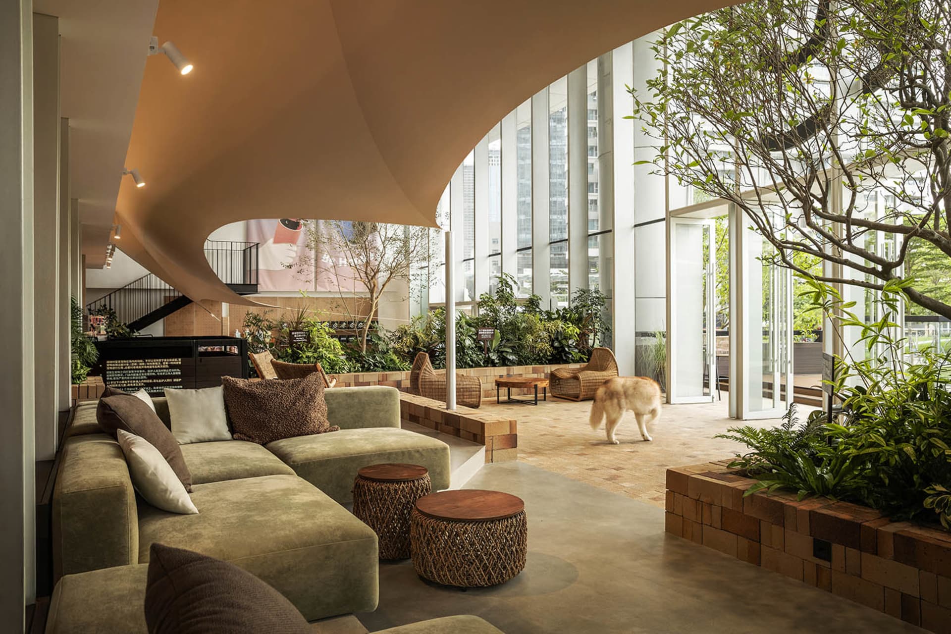 A modern lobby featuring concrete and glass materials.