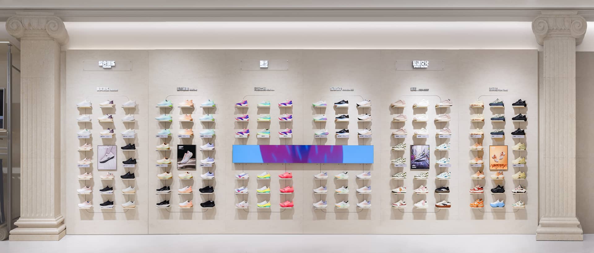 Multiple pairs of sneakers displayed on shelves in a retail setting.