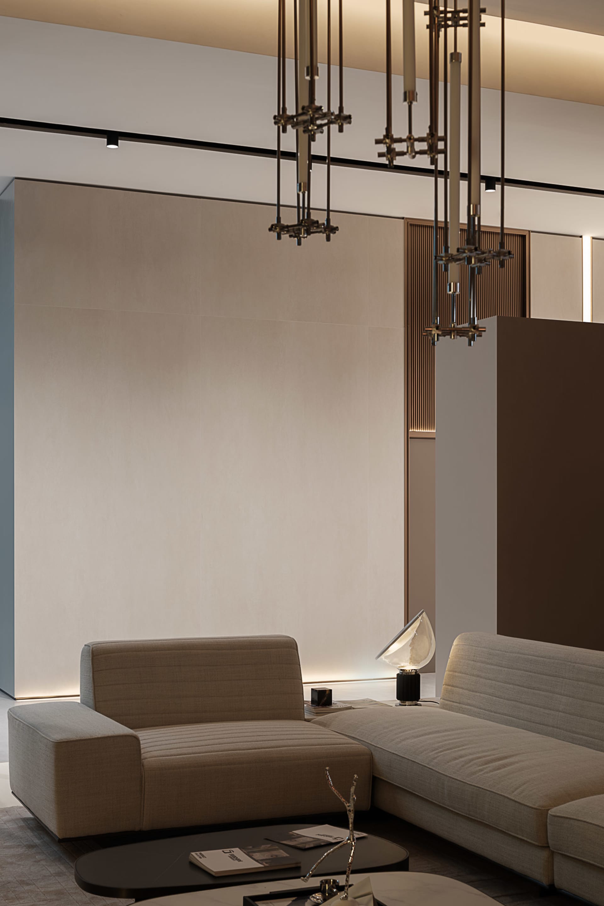 A modern living room featuring a beige textured couch with a sleek, metallic table lamp.