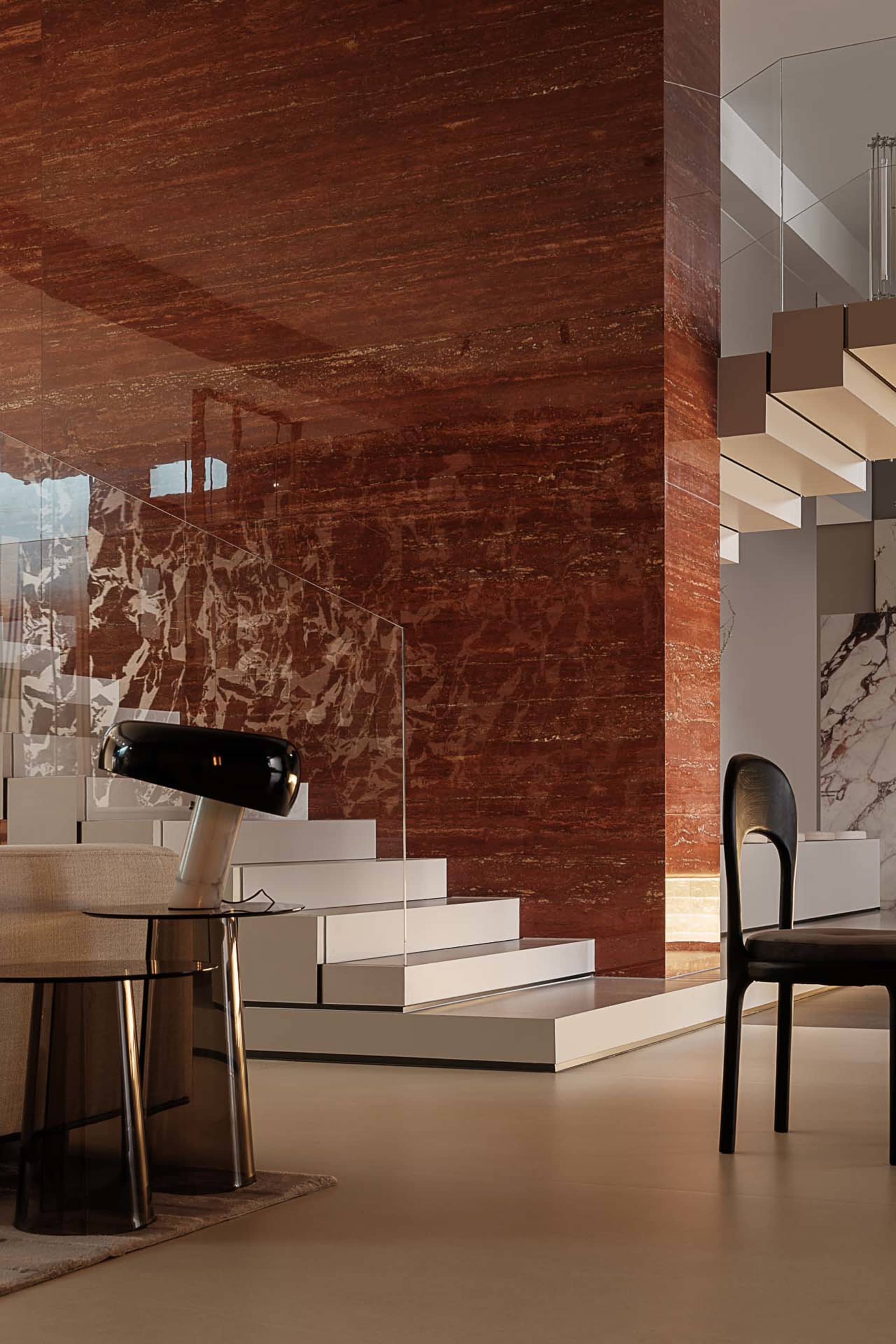 Modern living room with a staircase made of marble.