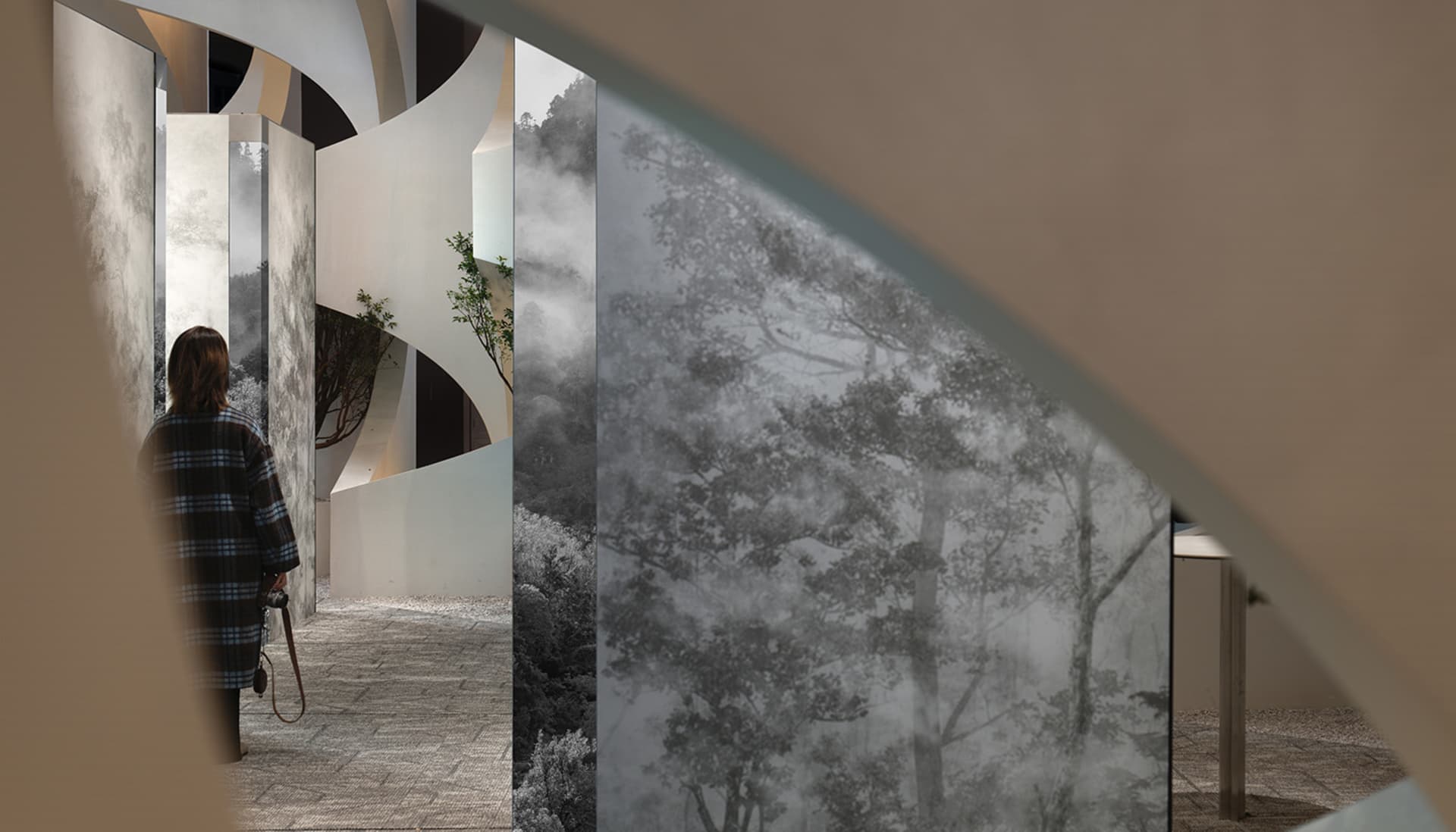 A modern interior with glass panels showcasing a landscape view.