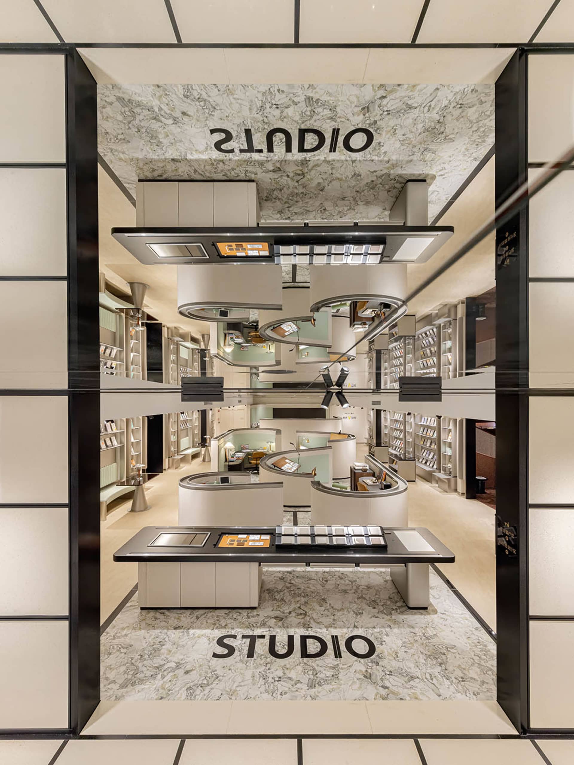 Modern retail storefront with marble and glass materials and a minimalist design.