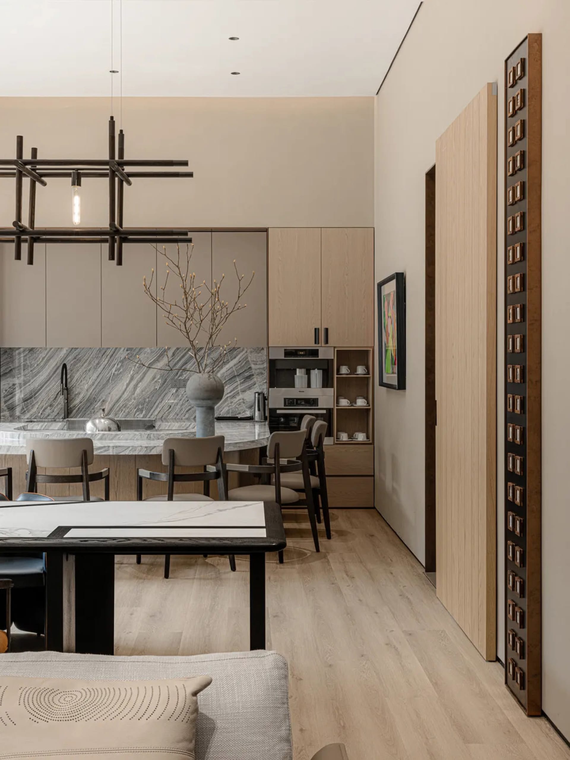 Modern kitchen featuring a marble countertop with a minimalist design aesthetic.