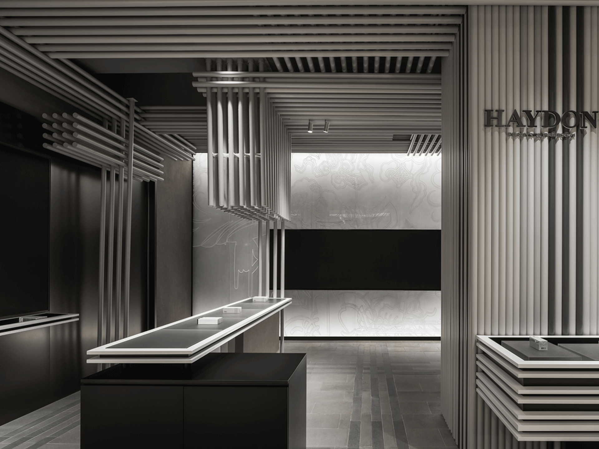 Modern retail shop interior with metallic finishes, wood paneling, and glass display cases