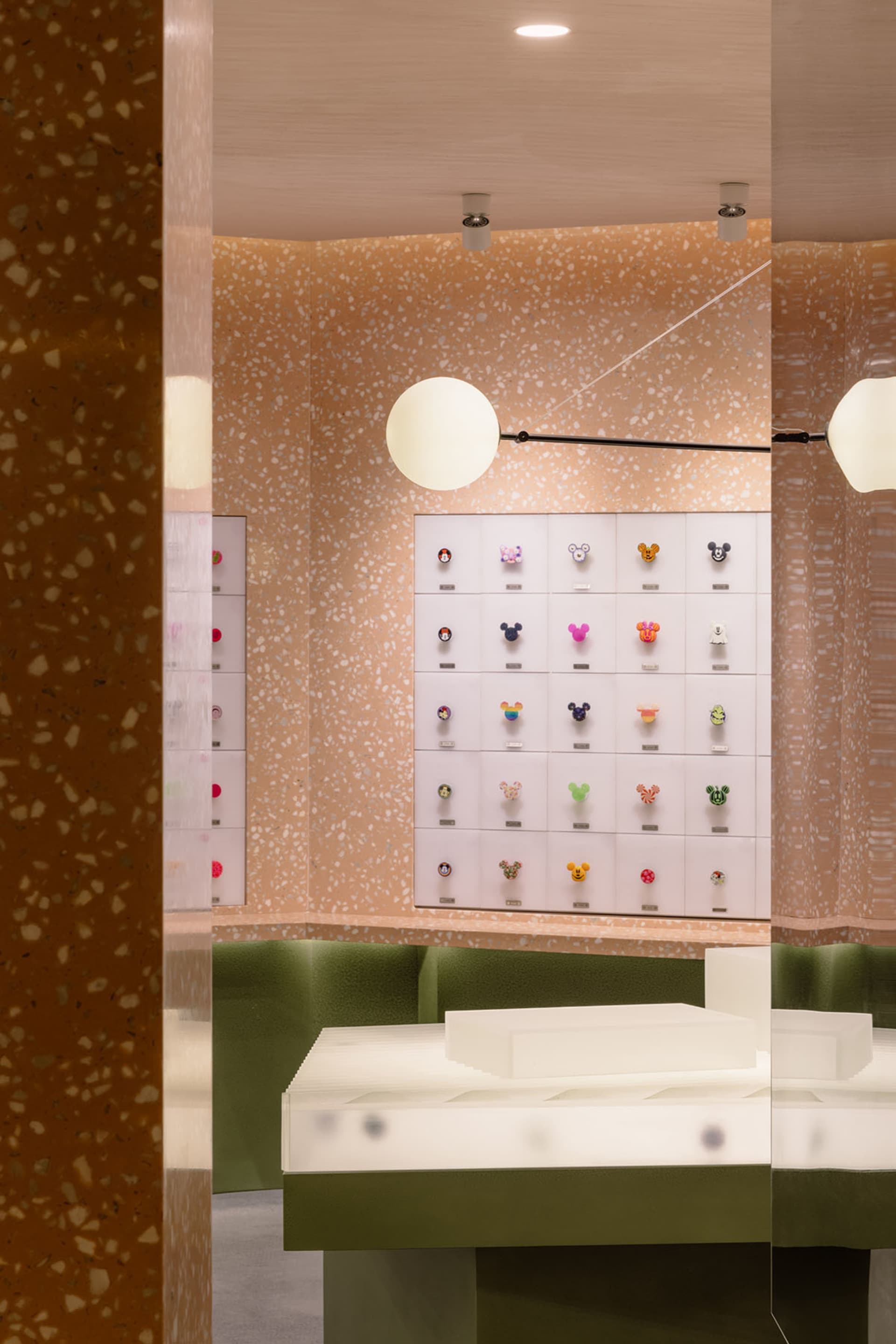 Interiors of a retail storefront featuring a concrete and terrazzo design.