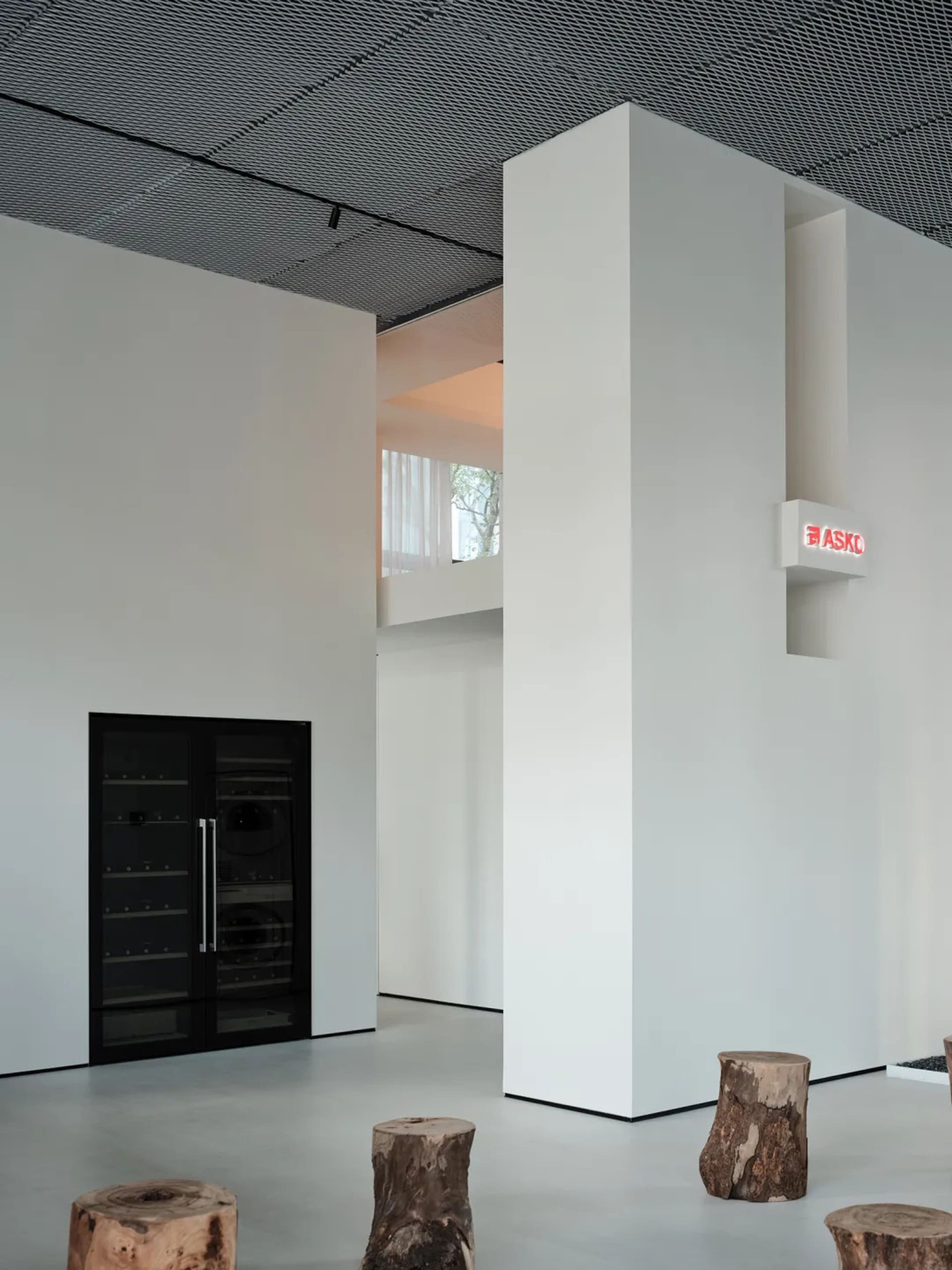 A minimalist commercial interior designed with concrete elements