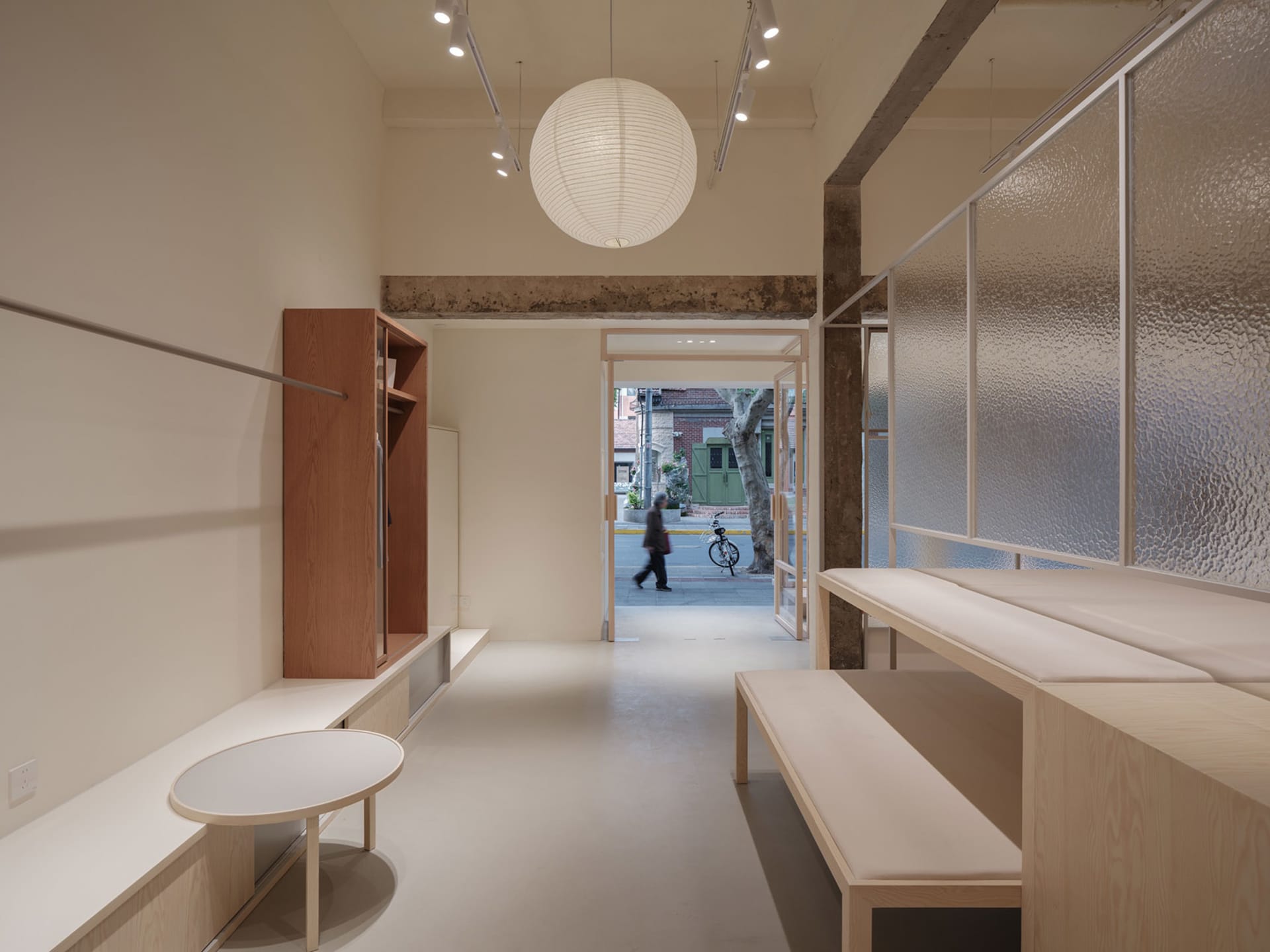 Modern retail storefront with minimalist design features, showcasing contemporary aesthetics and clean lines.