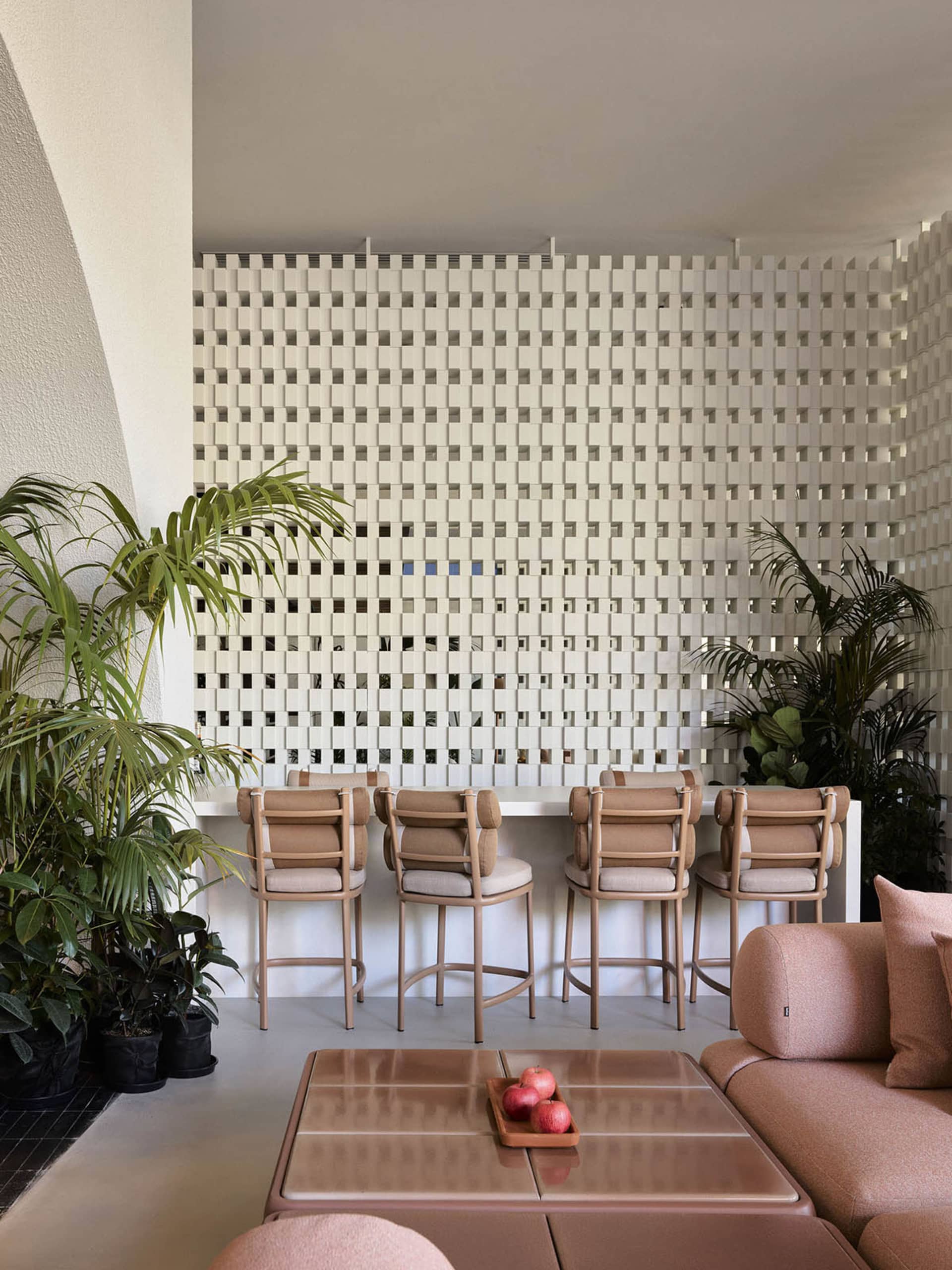 Interior of a modern coffee shop featuring concrete, glass, and wood materials.