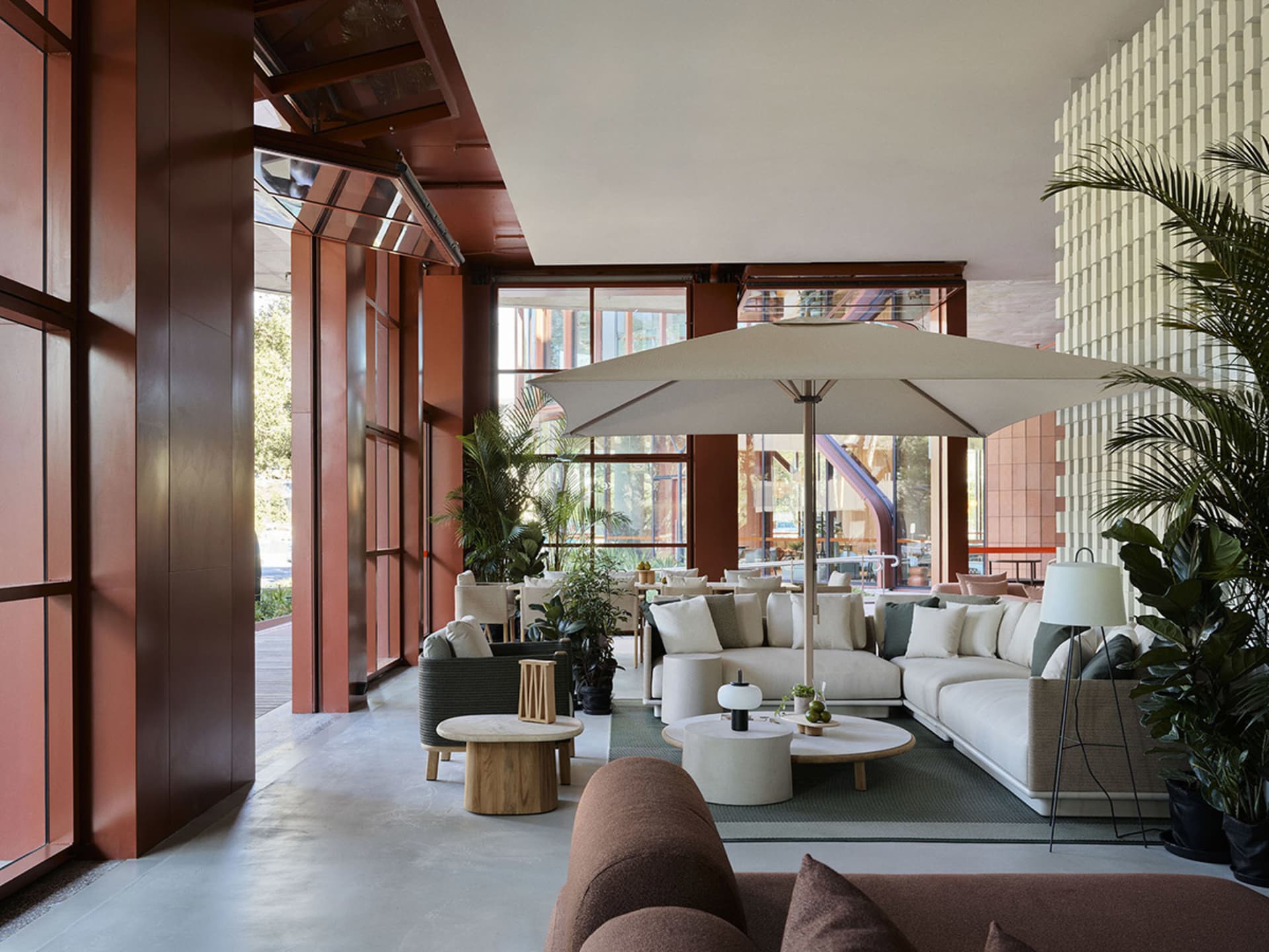 Modern lobby featuring concrete, wood, and fabric materials