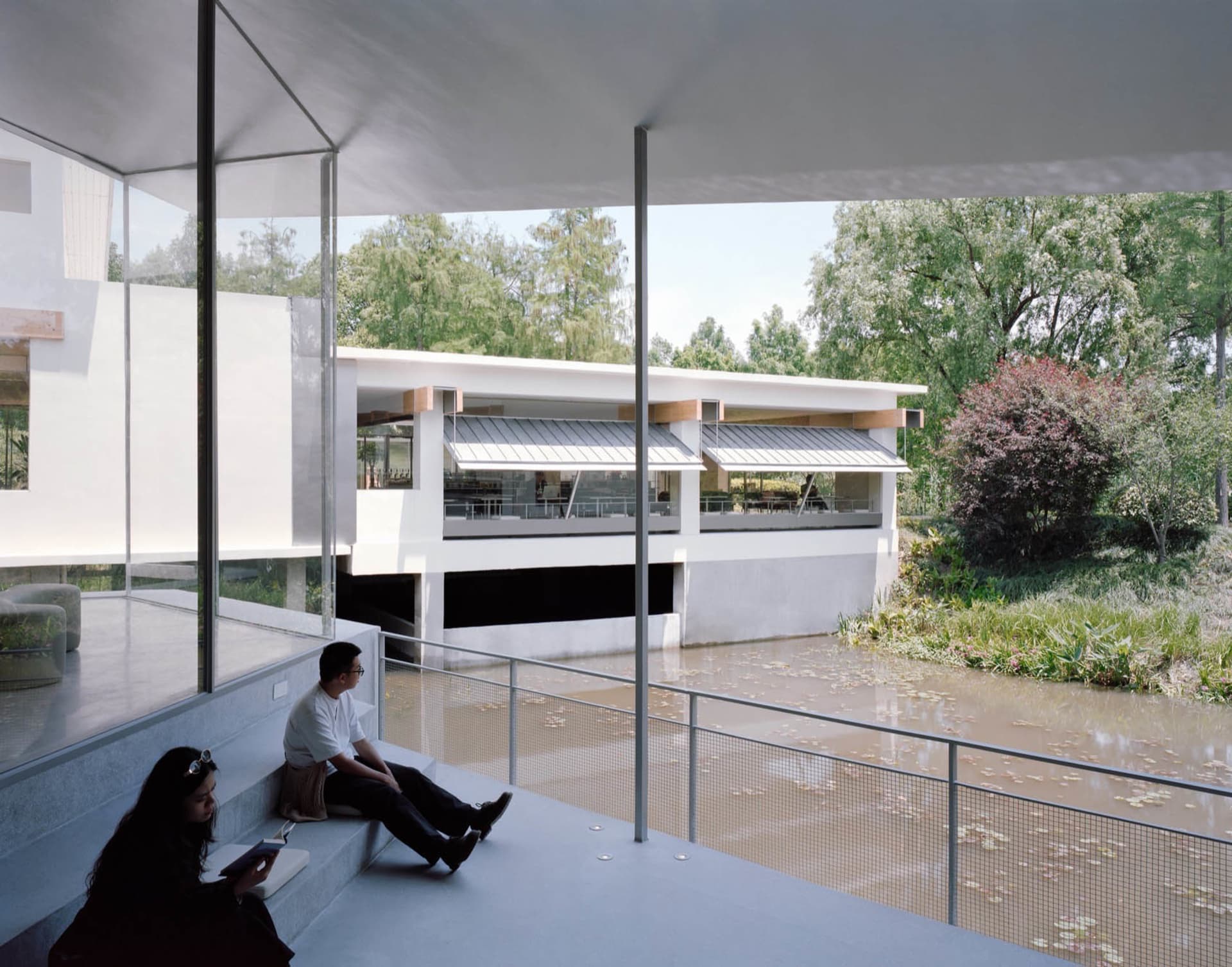 A modern architectural design featuring concrete, glass, and wood materials.