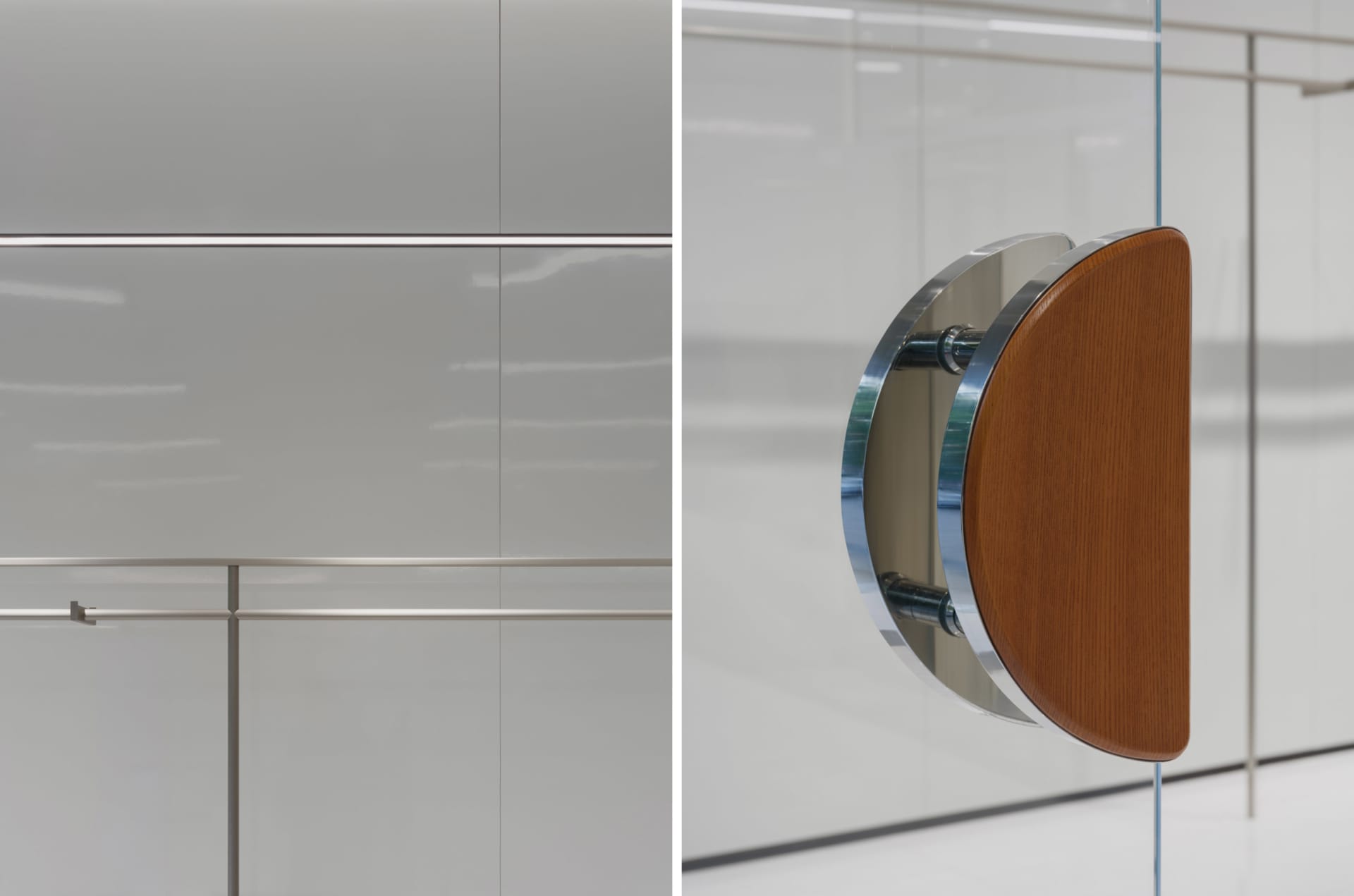 A minimalist office space featuring a glass panel with a wooden element and metallic accents.