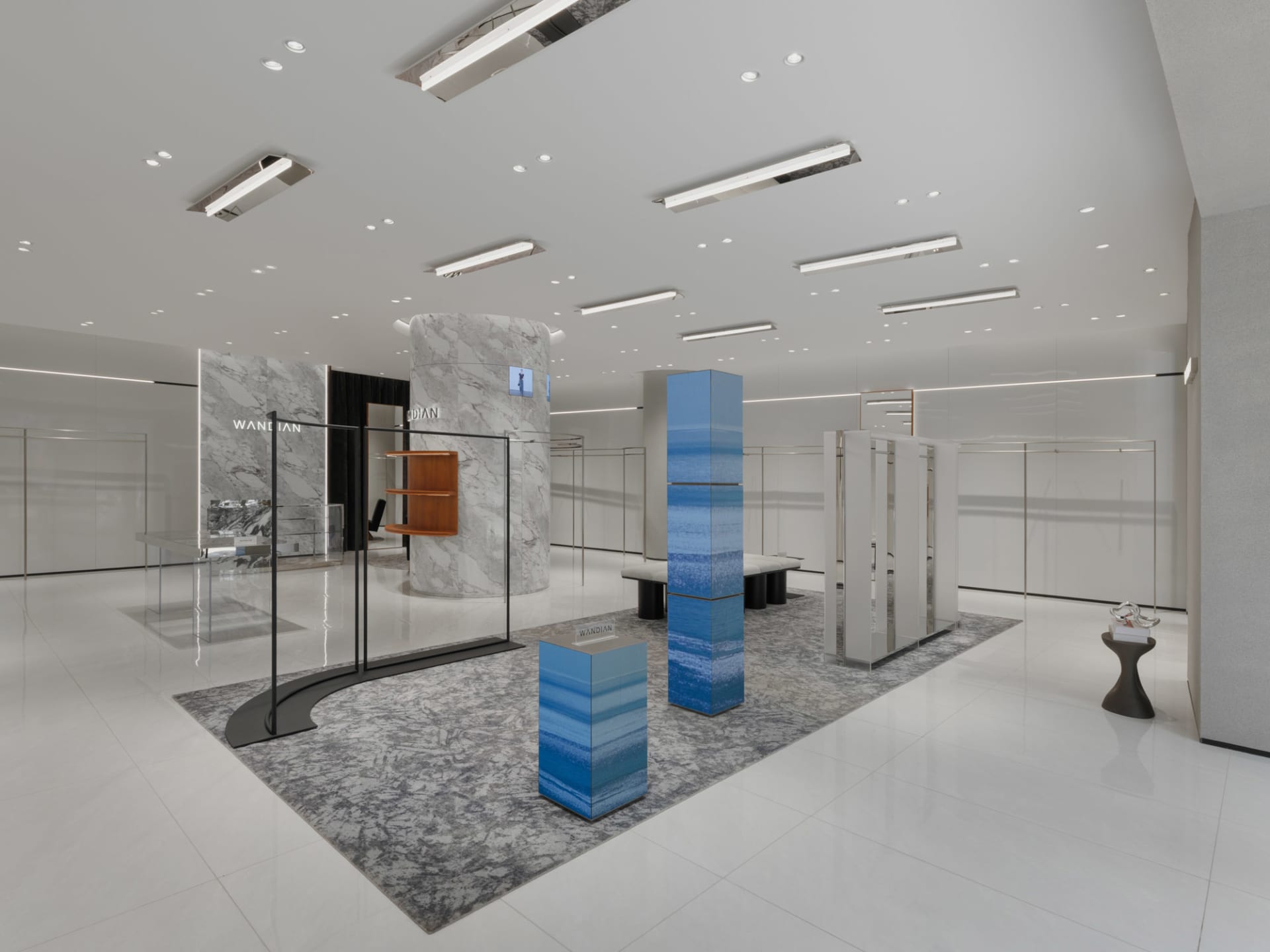 Modern retail storefront featuring glass, marble, and metal materials