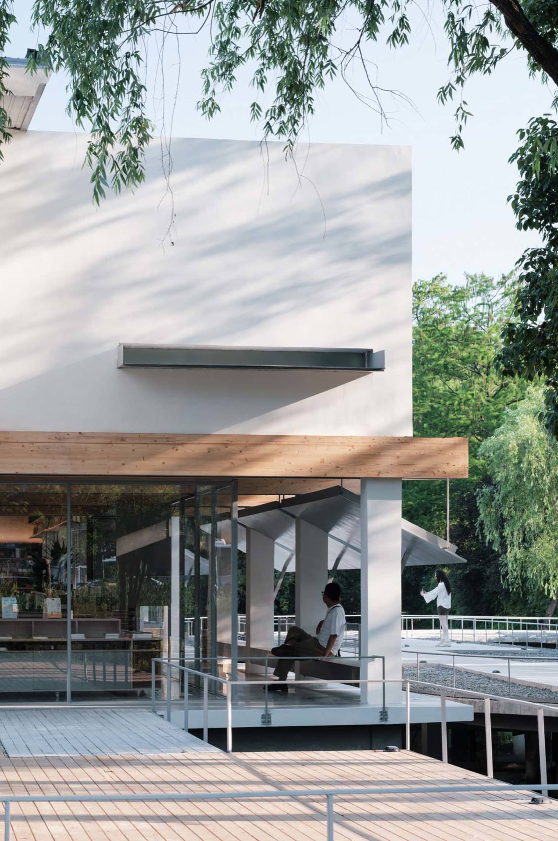 Modern interior design featuring wooden walls and glass windows.