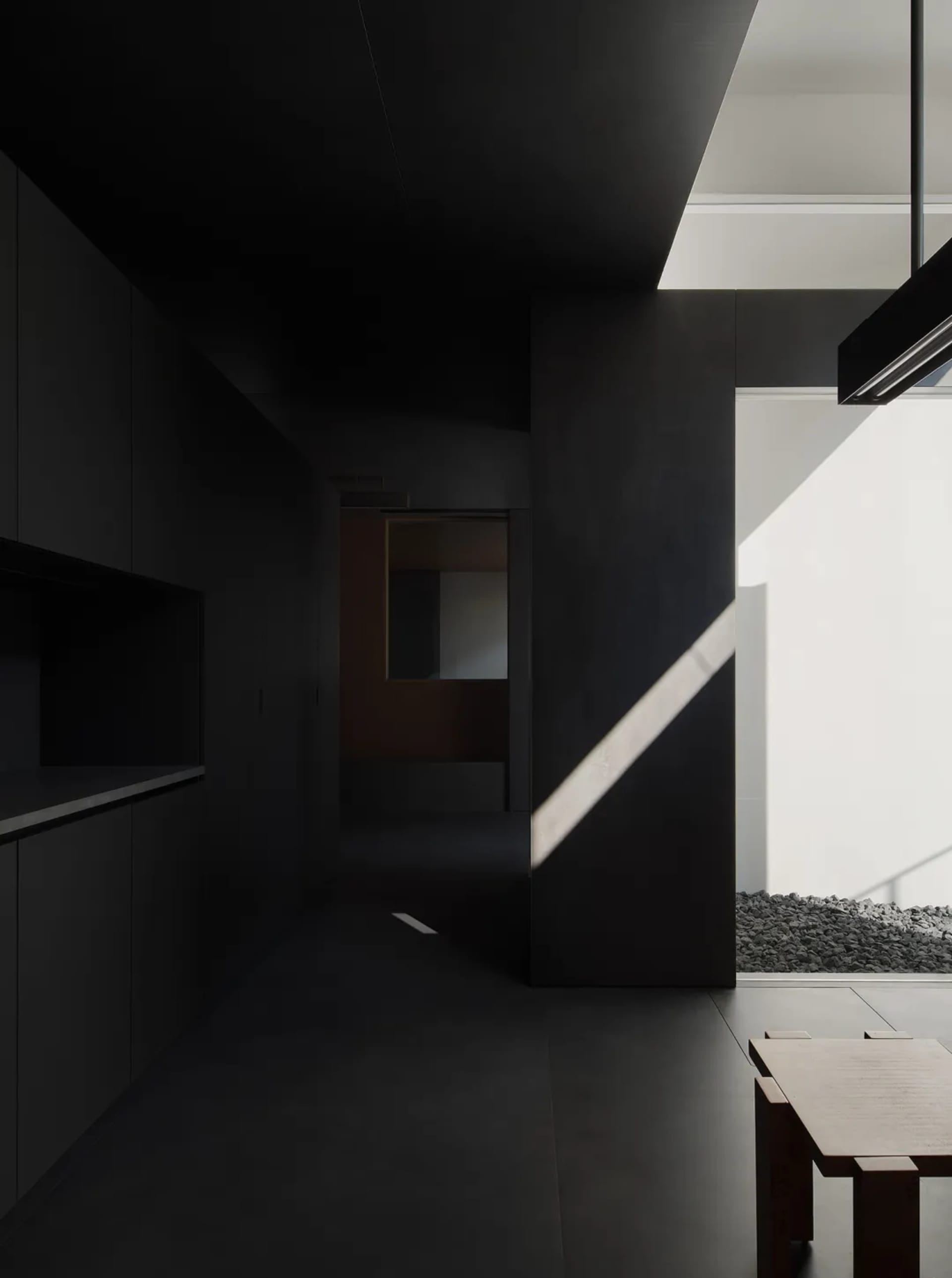 Modern minimalist interior space featuring concrete walls and floor.