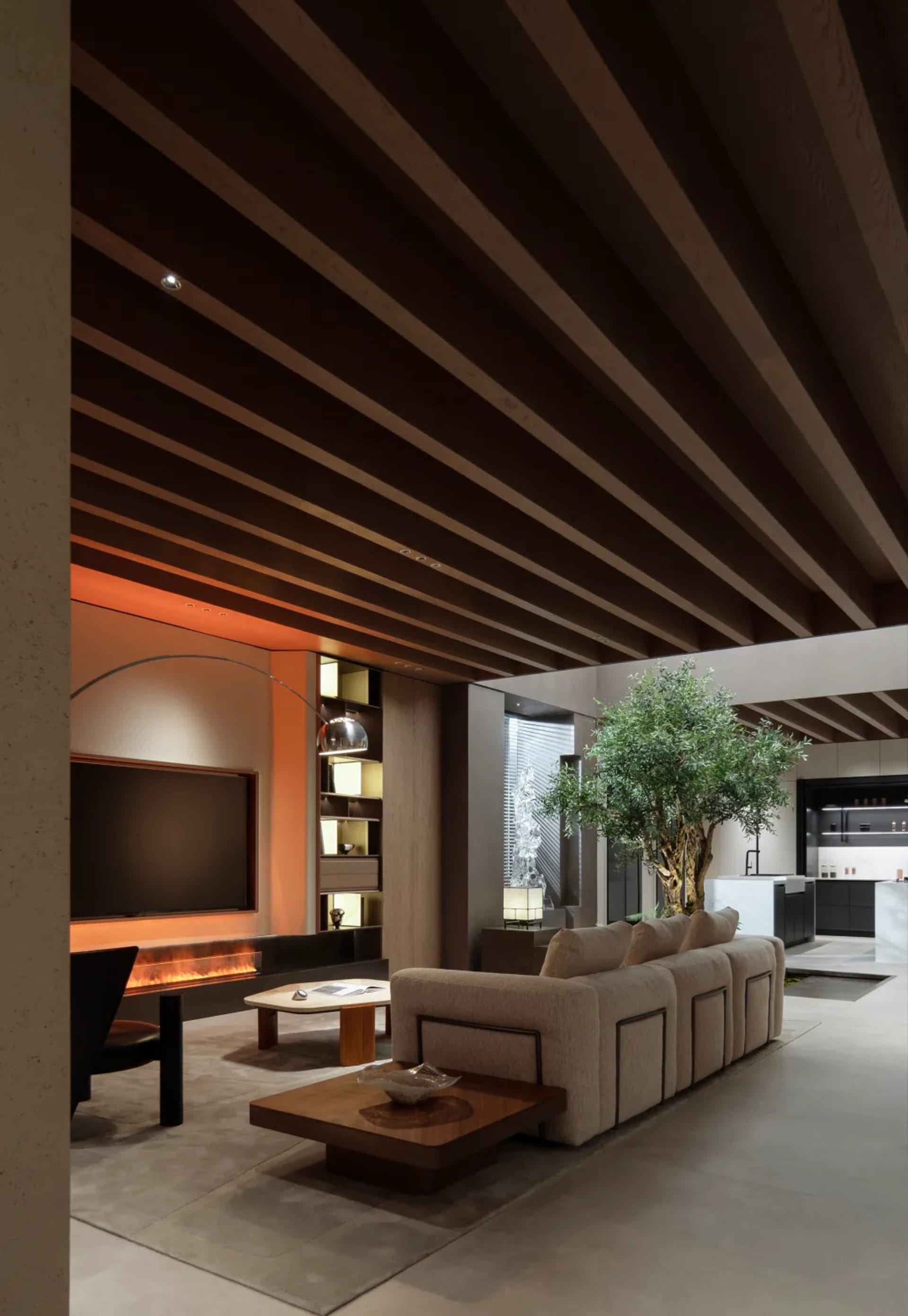 Modern living room with concrete flooring and a wooden sofa.