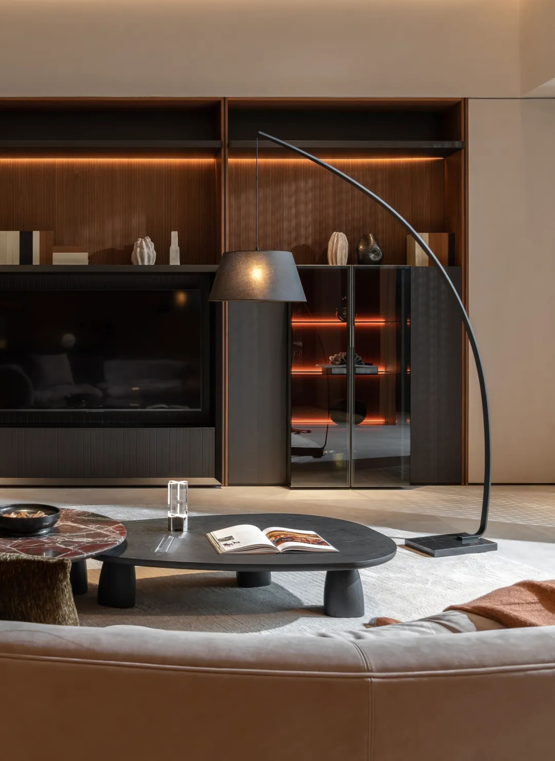Modern living room featuring elegant wood, glass, and metal fixtures