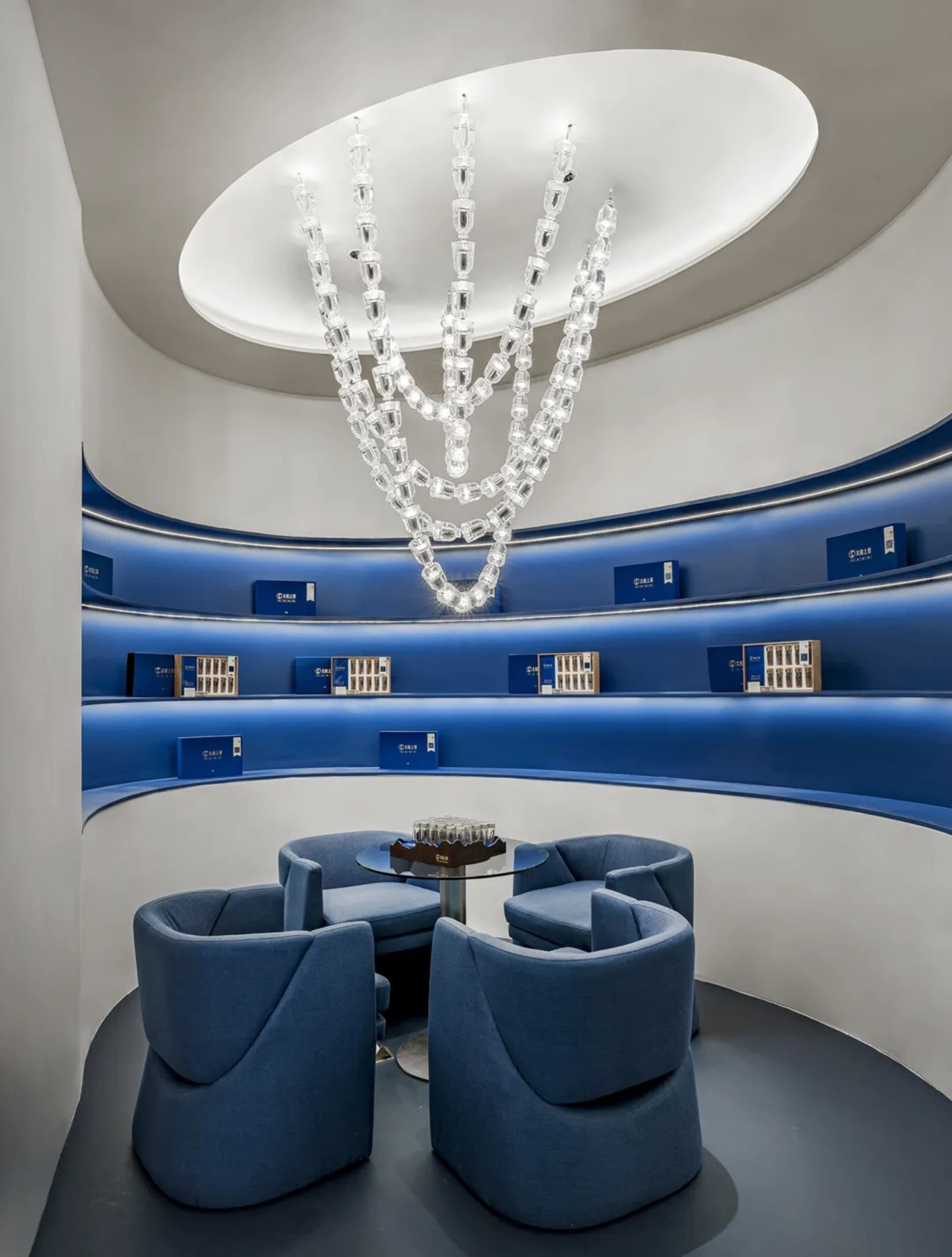 Modern retail storefront with blue display units and lighting feature